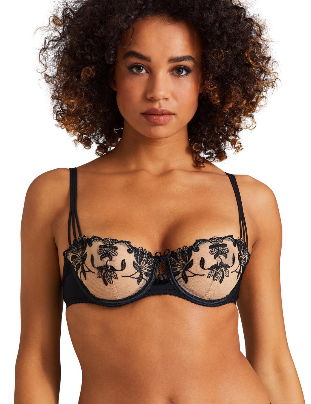 Aubade Lovessence half cup bra is a must-have for any confident woman that loves to look and feel glamorous. Made from incredibly soft, lightweight materials, with its non-padded, underwired design and delicate lace detailing. The adjustable shoulder straps and hook and eye fastening provide superior support and fit, while a cheeky keyhole cutout embellished with a bow detail ensures maximum sophistication. Fusing comfortability and sensuality, Aubade Lovessence is the ideal choice for the modern woman. With matching lingerie available, a complete lingerie set is just a few clicks away – allowing you to experience the ultimate in luxury.  Stunning half cup bra Non-padded Underwired for support Adjustable shoulder straps Hook and eye fastening Luxurious lace detailing Cheeky keyhole cutout with bow detail Matching lingerie available Country of origin: Tunisia Composition: Cup embroidery: 62% Polyester &pipe; 38% Polyamide Composition: Lining: 100% Polyamide Composition: Knit: 82% Polyamide &pipe; 18% Elastane Listed in UK sizes  61603-106744-1421888 RMF14 Half Cup Bra