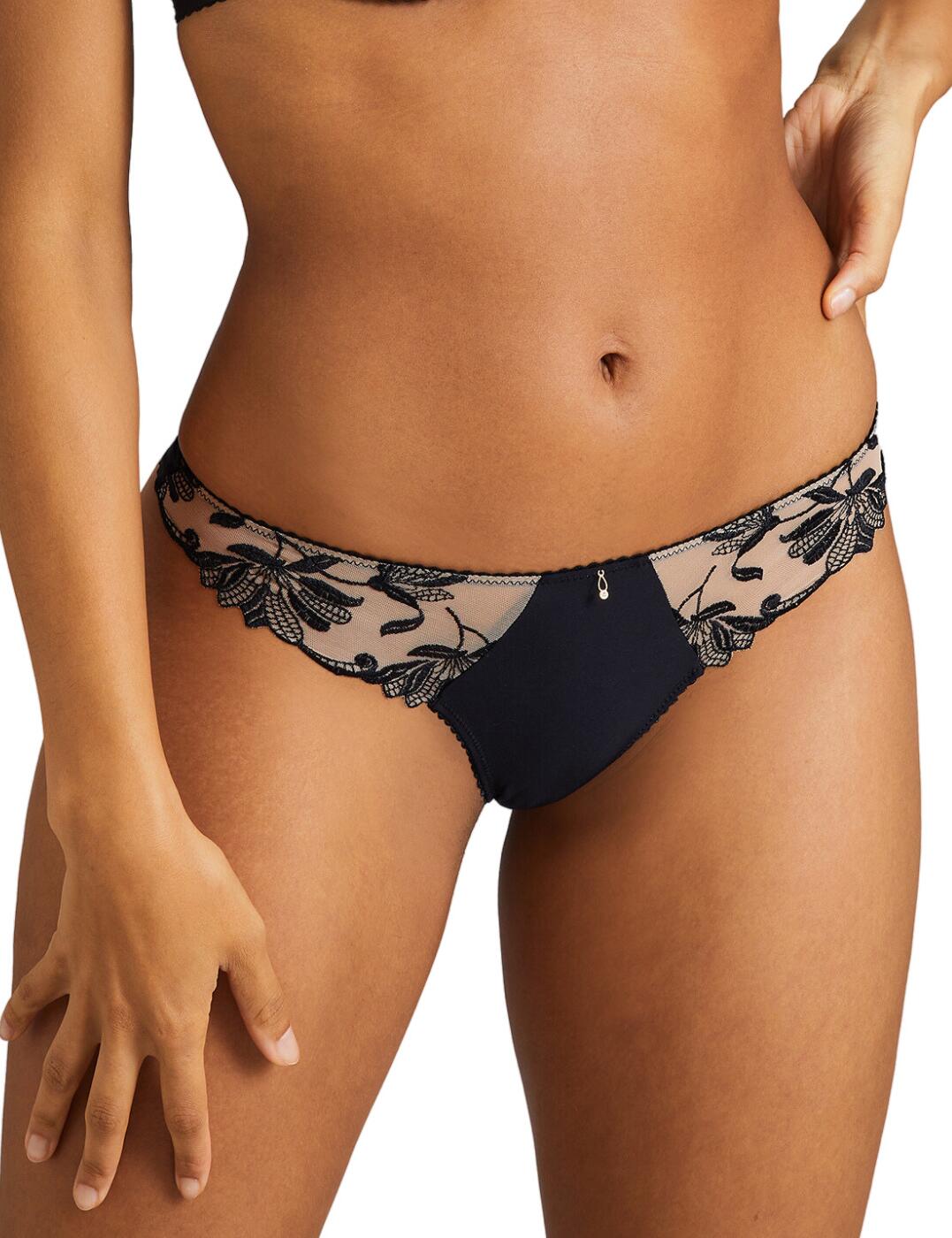 Welcome Aubade's Lovessence tanga brief, a luxurious lingerie must-have. Sure to make a statement, this tanga brief gives a modern take on traditional lingerie, with its low-rise waist and minimal rear coverage. Alluring and alluringly feminine, the look is completed with exquisite lace detailing, creating a truly indulgent and exceptional look. Plus, the cheeky keyhole cutout with bow detail on the rear of this piece, gives that extra something special. Despite its modern design, the Aubade Lovessence tanga brief provides the ultimate comfort and fit, emphasising your figure to the highest levels. To complete the look, a range of captivating coordinating lingerie pieces are available.  Luxurious tanga brief Low-rise waist Minimal rear coverage Feminine lace detailing Cheeky keyhole cutout with bow detail on the rear Matching lingerie available Country of origin: Tunisia Composition: Embroidery: 52% Polyester &pipe; 34% Polyamide &pipe; 14% Elastane Composition: Seat: 100% Cotton Composition: Knit: 82% Polyamide &pipe; 18% Elastane Listed in UK sizes  61607-106752-1421999 RM26 Tanga Brief