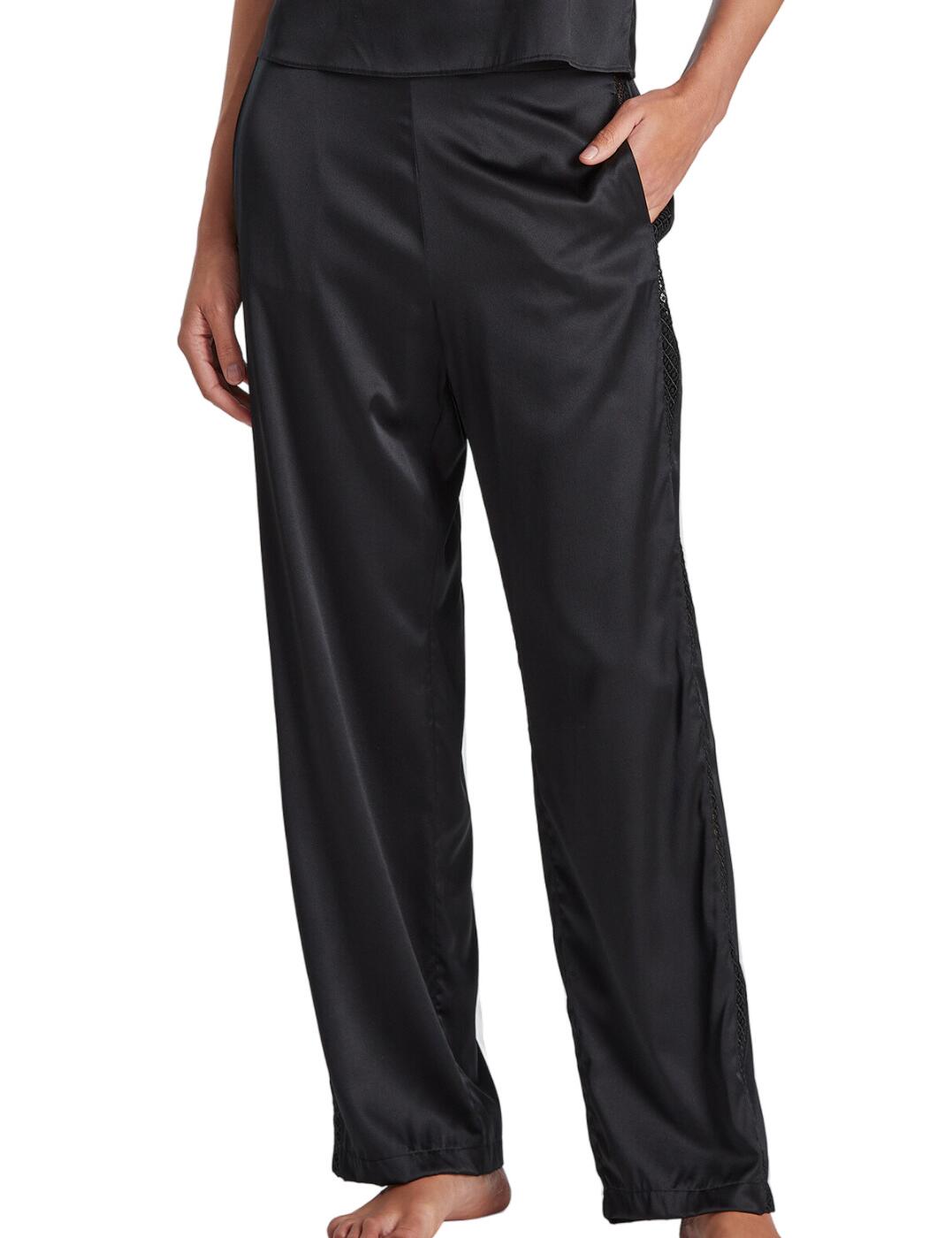 Let yourself succumb to elegance and comfort with the Aubade Silk Desire trousers. Made with luxurious stretch silk, these flowing trousers are designed to make sure you stay relaxed all night long. With a loose, full-length fit, these trousers move with you, making them ideal for lounging around all day and night. The ladder stitch detailing also adds a playful hint of modern style, showcasing peaks of your skin in an understated, yet irresistible way. Pair them with other coordinating items, such as the matching Aubade Silk Desire top, for the ultimate night of serenity.  Sleep trousers Flowing and loose fitting Could wear day and night Made front stretch silk Ladder stitch shows off peaks of skin Loose cuffs Full leg length fit Matching coordinates available Country of origin: China Composition: Main Fabric: 92% Silk &pipe; 8% Elastane Composition: Embroidery: 100% Polyester Listed in UK sizes  61637-106787-1412285 RJ60 Loungewear