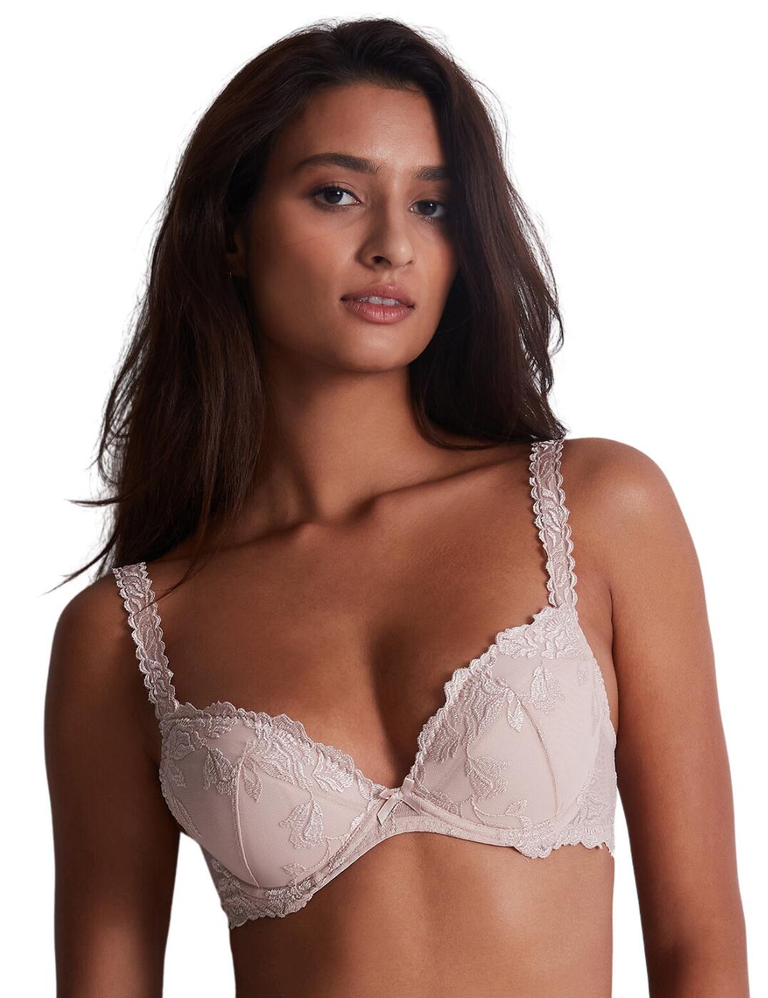 Go for glamorous lingerie with impeccable flair with the Aubade Softessence plunge bra. The perfect balance of femininity and function, this plunge bra features a velvet-look floral pattern, recycled embroidery, and a bow with delicate lace in a satin ribbon that provide an exceptionally beautiful finish. This plunge bra is designed to provide maximum support in all the right places. Underwired for support, padded for uplifting shape, and with a wide back for optimal comfort, it ensures you feel naturally supported throughout the day. Moreover, the adjustable shoulder straps and hook and eye closure allow you to easily customize the fit to best suit your needs. Plus, there are equally stunning, matching coordinates available so that you can complete the Softessence look.  Plunge bra The velvet look floral pattern Recycled embroidery Underwired for support Padded for uplifting shape Wide back for optimal comfort Bow and delicate lace in satin ribbon Scalloped straps for soft finish Adjustable shoulder straps Hook and eye closure Matching coordinates available Country of origin: Tunisia Composition: Embroidery: 47% Polyester &pipe; 38% Polyamide &pipe; 15% Elastane Composition: Lining: 100% Polyamide Composition: Bottom lining: 100% Cotton Listed in UK sizes  61642-106792-1412301 TMN18 Plunge Bra