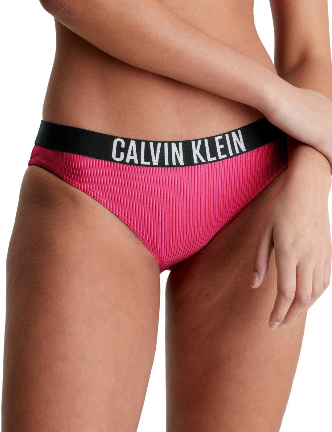 If you're looking for the perfect bikini brief for your wardrobe, look no further than the Calvin Klein Intense Power bikini brief. Including a mid-rise waist, moderate rear coverage, and a fully lined interior. Plus, you'll find a luxe rib texture and a signature Calvin Klein elasticated waistband for an extra of touch of style. Top it off with a selection of matching coordinates available, and you have the perfect bikini brief for your wardrobe.  Mid-rise fit Moderate rear coverage Signature Calvin Klein elasticated waistband Matching coordinates available Country of origin: China Composition: 85% Recycled Nylon &pipe; 15% Elastane Listed in UK sizes  61741-106907-1423211 KW0KW01986 Bikini Bottoms