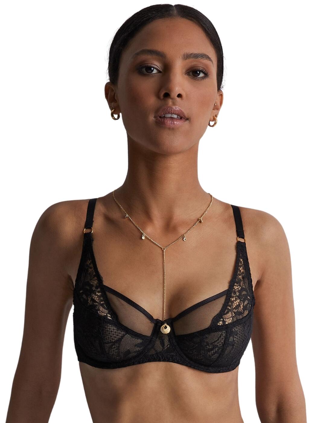 Indulge in luxury with Aubade Gold Pleasure, an exquisite bra designed for opulence. Featuring a flattering balcony design, non-padded cups, underwiring for support, and a high apex for allure, it offers a confidently sensual look. The adjustable straps and hook and eye fastening ensure comfort, while sheer lace cups and a removable gold chain add elegance and glamour. Complete the look with matching briefs and suspenders for the ultimate indulgence. Elevate your lingerie collection with Aubade Gold Pleasure.