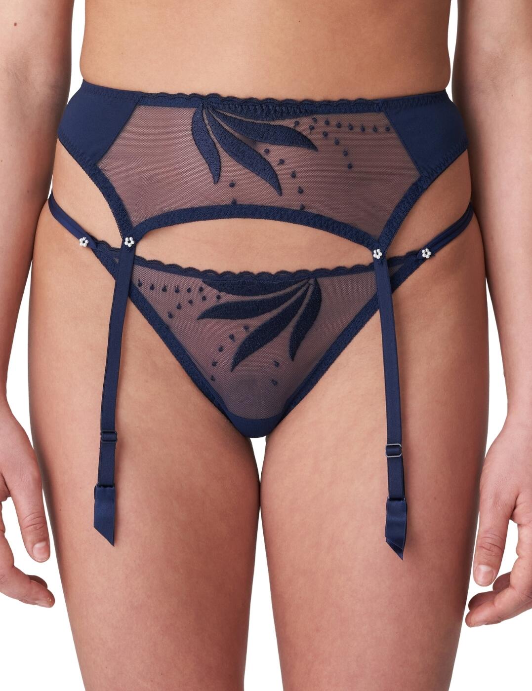 Get ready to turn heads in this jaw-droppingly gorgeous garter belt from Marie Jo's Etoile range! Dripping with seduction and luxurious sophistication, the sheer tulle fabric reveals your skin suggestively. The abstract leaf motif that runs through the Etoile line creates a trendy 80s aesthetic, bringing retro vibes to this stylish item! This standout piece can be worn at the hips or the waist with a hook and eye closure that enables you to tailor your fit as desired. The garters can be fastened to stockings for a truly show-stopping look, or worn just as alluringly on its own! Pair this item with matching coordinates from the Etoile range for an unforgettable look!  Luxury garter belt Seductive design Sheer tulle Abstract leaf print Garters can be attached to tights Hook and eye closure Can be worn at the hip or the waist Matching co-ordinates available Composition: 57% Polyester &pipe; 41% Polyamide &pipe; 2% Elastane Listed in UK sizes  61435-106490-1407459 0702740 Garter Belt