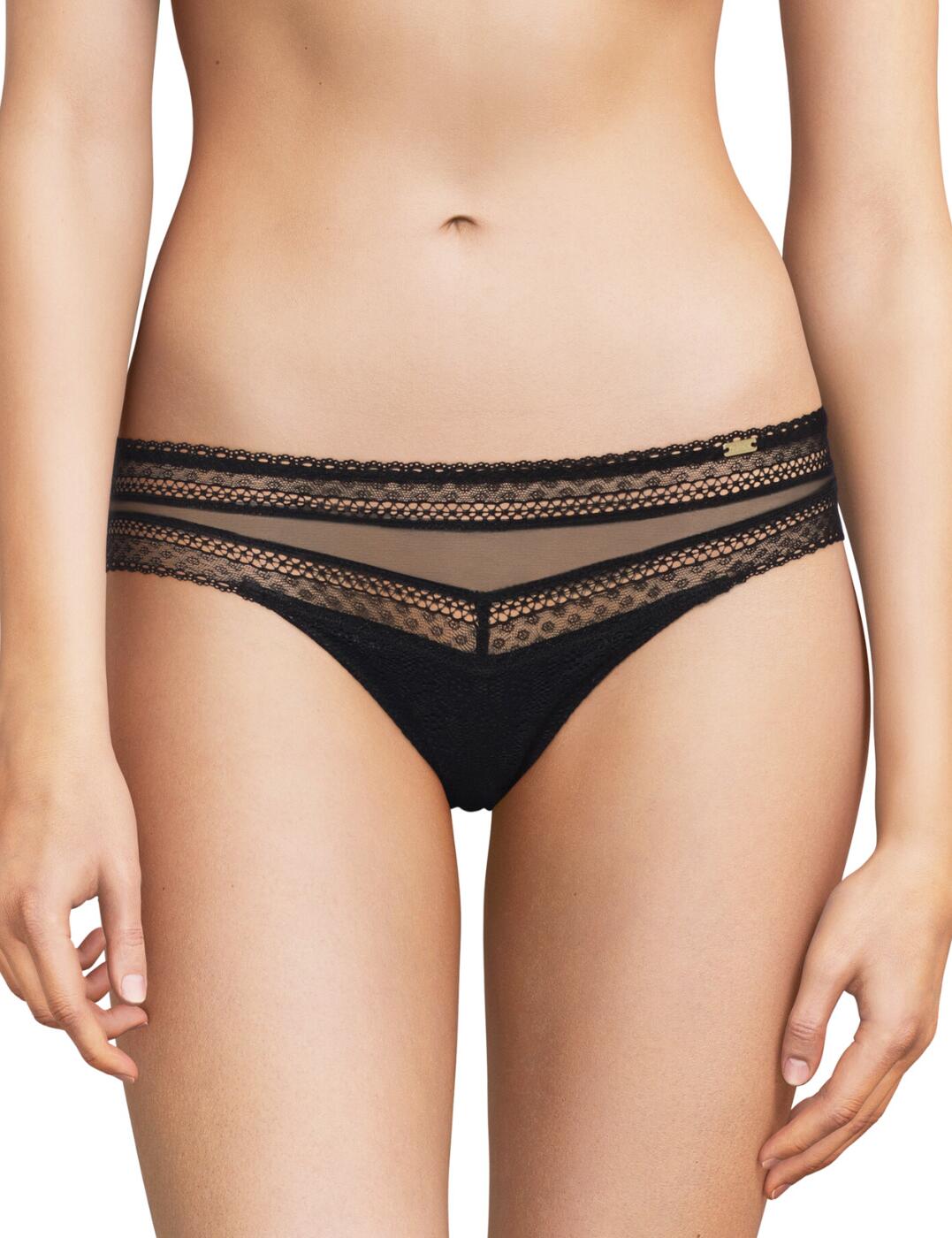 Playful seduction reigns with this fabulous tanga brief from Chantelle's Festivite collection! Certain to add a touch of sensuality to your everyday wardrobe. The seductive tanga shape and low-rise waist flaunts your curves beautifully, while still giving good rear coverage for a touch of modesty. The transparent, decorative lace main teasingly shows off your skin, and the opaque 100% cotton gusset gives you exceptional comfort! These briefs have it all! Finished with a delicate Chantelle logo plaque on the front for an additional flourish. Pair with the coordinating bra from the Festivite range for a truly show-stopping look!  Luxury tanga brief Seductive shape Low-rise waist Moderate rear coverage Light materials Transparent, decorative lace main Chantelle logo plaque Matching items available Country of origin: Thailand Composition: Lace back: 71% Nylon &pipe; 29% Elastane Composition: Lace: 80% Nylon &pipe; 20% Elastane Composition: Tulle: 82% Nylon &pipe; 18% Elastane Composition: Gusset: 100% Cotton Listed in UK sizes  61489-106562-1409368 C36890 Tanga Brief