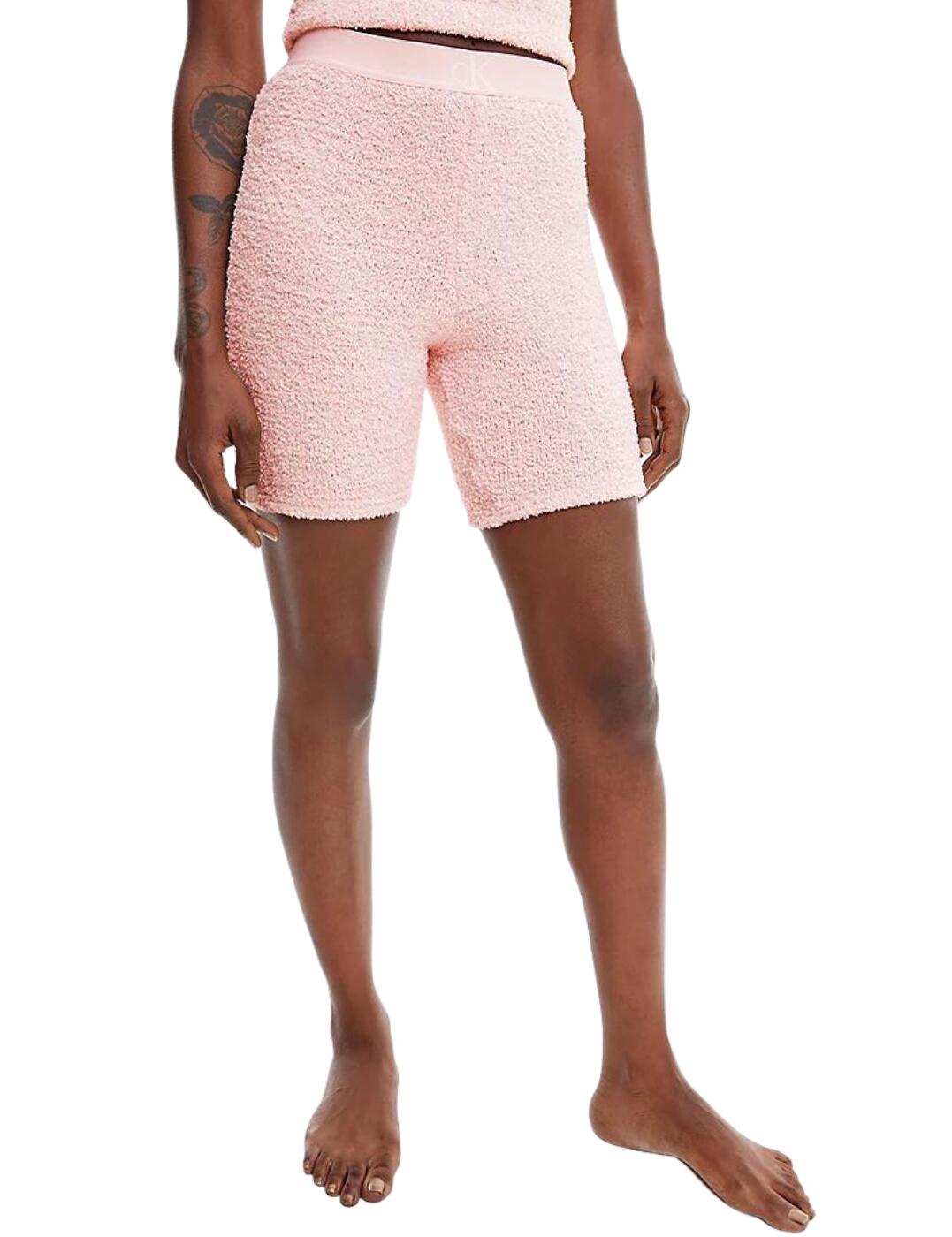The CK One Plus Loungewear sleep short is perfect for those colder nights this season. These mid-length shorts give a modest and comfortable fit. The elasticated waistband provides a comfortable and secure fit and features subtle Calvin Klein branding in a contrasting colour. Matching items are available from the CK One Plush range.  Mid-length short Calvin Klein branding on waistband Pull-on design Country of origin: Sri Lanka Composition: 75% Polyester &pipe; 25% Nylon Listed in UK sizes  51865-93474-1240243 QS6770E Lounge Shorts