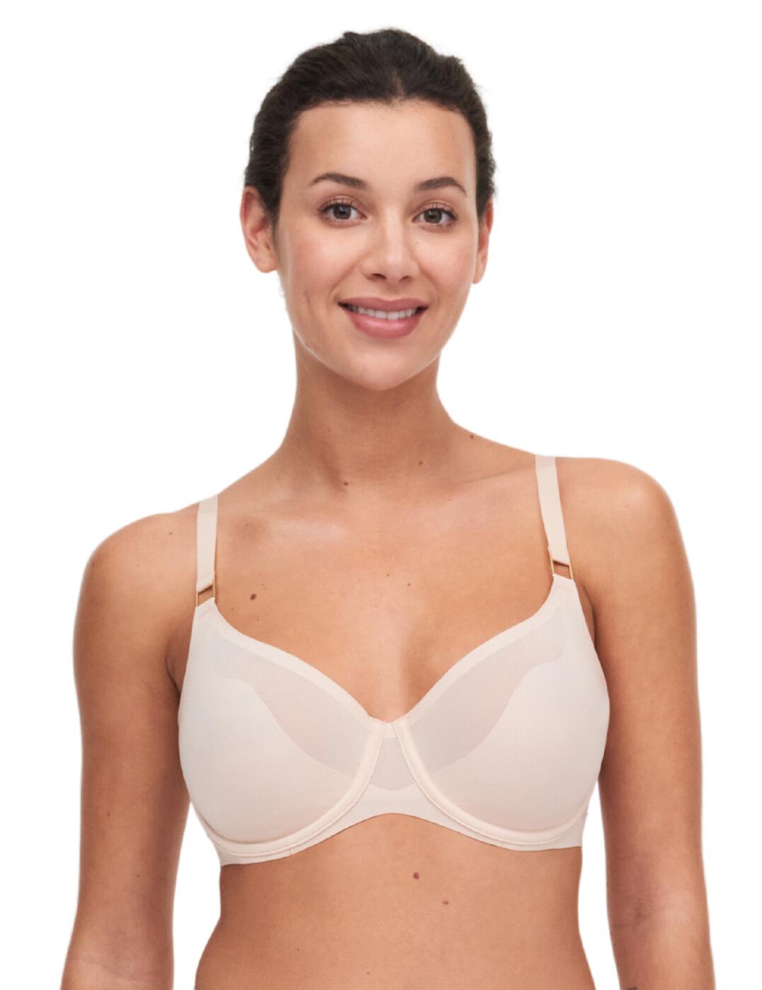 Embrace comfort and sensuality with this luxurious moulded bra from Chantelle's Pure Light range! Designed for wear under a range of clothing with the ultra-flat finish, smooth cups, and use of light materials make this perfectly invisible and suitable for everyday use. Underwire and light padding give you all-day support with a natural uplift. A pure and modern design, the sensual wave design on the cups subtly reveals your skin to flatter your figure beautifully. Fully adjustable straps and a 4-rank padded hook and eye closure allow you to tailor this bra to your desired fit. Pair with coordinating briefs from the Pure Light range to take this luxurious look and feel to the next level!  Luxurious moulded bra Balcony neckline Sensual wave design Seamless moulded cups Chimney back for optimal support Rectangular buckle details at the base of straps 4-rank hook and eye closure Fully adjustable straps Underwired and lightly padded Matching underwear available Country of origin: Vietnam Composition: Main: 70% Nylon &pipe; 30% Elastane Composition: Cup: 72% Nylon &pipe; 28% Elastane Composition back: 68% Nylon &pipe; 32% Elastane Listed in UK sizes  61495-106608-1409092 C10M10 Moulded Bra