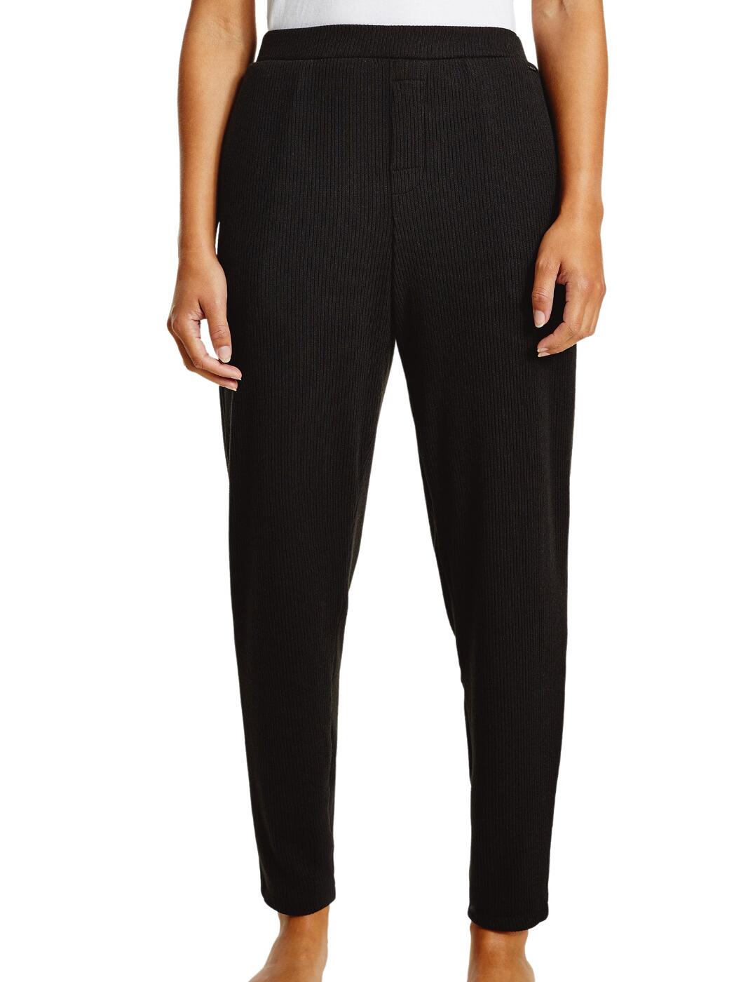 The Ease collection combines the softest rib knit fabrics with an iconic Calvin Klein athleisure style for the utmost luxurious loungewear series. These premium joggers have a small Calvin Klein tag on the front for a subtle designer detail. The elasticated waistband and cuffed legs create a cosy slim fit. Wear with the matching bodysuit from the Ease collection by Calvin Klein.  Slim-leg style Soft rib-knit fabric Calvin Klein tag Country of origin: Sri Lanka Composition: 95% Polyester &pipe; 5% Elastane Listed in UK sizes  51875-93481-1238297 000QS6749E Jogger