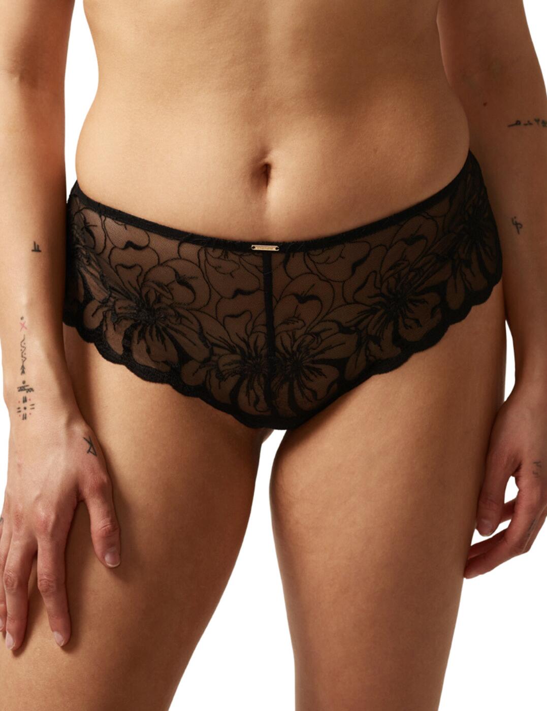Elevate your lingerie wardrobe with this elegantly designed shorty brief from Chantelle's Fleurs range! Sophisticated and luxurious, these briefs are crafted from revealing lush, floral embroidery that exudes seduction. The 100% cotton gusset ensures a comfortable fit, suitable for everyday use, while the elastic finish at the waist makes these briefs even more comfortable, and minimises visibility under form fitting clothing. The mid-waist design with cheeky rear coverage flatters your figure perfectly. The classic Chantelle branded plaque on the waist finishes off this piece with an opulent flourish! Coordinate with matching items from the Fleurs range to complete the look.  Luxury shorty brief Mid-rise waist Cheeky rear coverage Floral embroidery 100% Cotton gusset Branded plaque on the front Elastic finish at the waist Matching bra available Country of origin: Morocco Composition: Embroidery: 51% Nylon &pipe; 28% Polyester &pipe; 21% Elastane Composition: Lace: 77% Nylon &pipe; 23% Elastane Composition: Knit: 100% Cotton Listed in UK sizes  61500-106574-1408701 C12M40 Short Brief