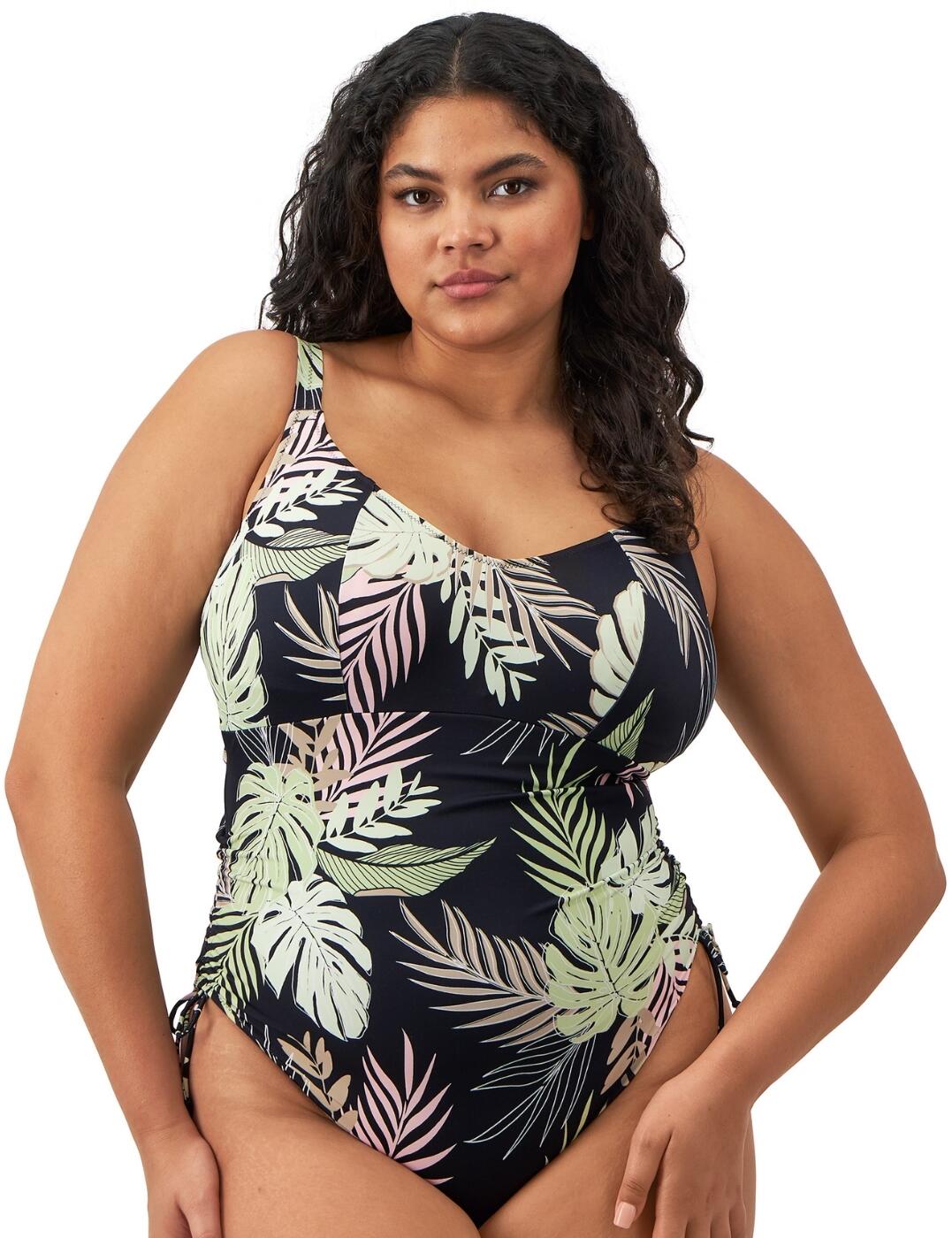 Sophisticated style with a trendy, modern twist is yours for the taking on your next holiday with this gorgeous swimsuit from the Tropical Retreat collection by Elomi! A jungle theme print crafts a bold and vibrant look that evokes confidence and sophistication, while the non-wired design offers a more natural fit without compromising on support! Full cup coverage, adjustable shoulder straps, and an extensive range of bra sizing in the cups ensures a flattering and supportive fit, and the clasp fastening on the rear with a chic cut-out detail enables a reassuring ease of wear to this piece. What's more, the suspended shelf is set into a wide underband frame to further support your gorgeous curves as you enjoy the beach or pool! A final detail to this must have swimsuit is the fabulous adjustable tie sides on the legs, creating not only a feminine flourish to the overall aesthetic, but also the opportunity to alter your look as you desire! With all this on offer, this beautiful piece from the Tropical Retreat range is absolutely unmissable!