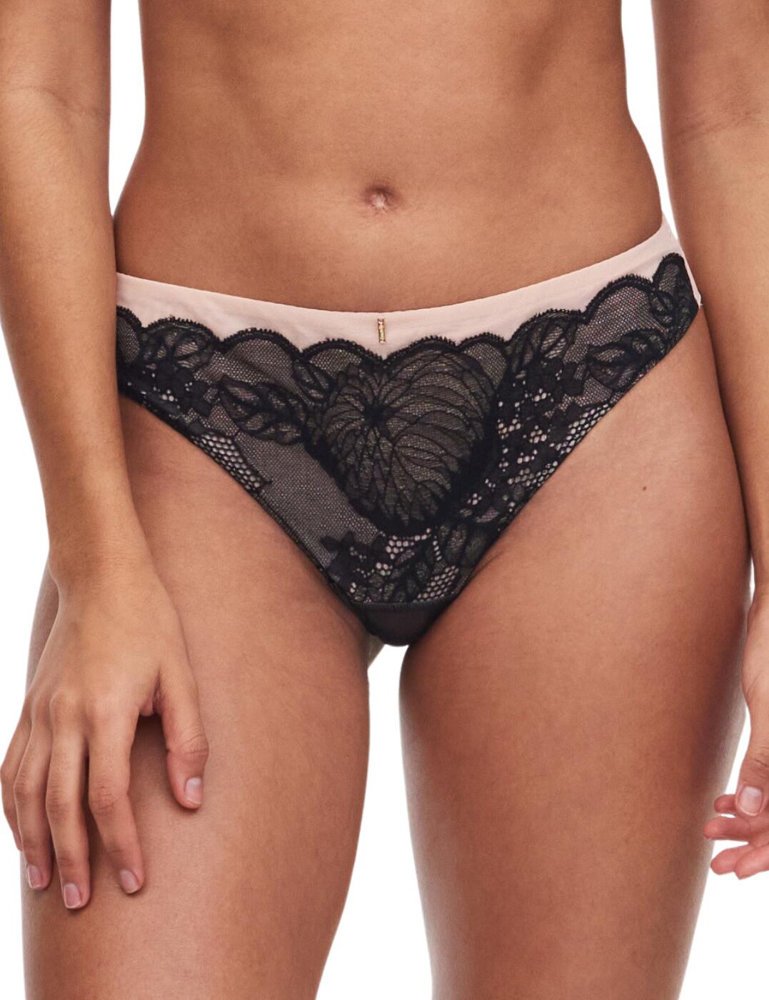 Feel luxurious and feminine in this gorgeous tanga brief from Chantelle's Midnight Flowers range! A low-rise waist flatters your figure beautifully, and the flirty lace creates a seductive vibe. The stylish floral lace inlay on the front brings an effortlessly elegant feel to your everyday lingerie collection. The cheeky rear coverage and invisible folded tulle back with a centre cut-out combine to accentuate your curves seductively and create a playful yet sophisticated visage. The invisible seam at the waist and back makes this item perfectly invisible under even the most form-fitting clothes! Coordinate with the matching bra from the Midnight Flowers range for a truly sensual look!  Luxurious tanga brief Delicate floral lace inlay front Invisible seam folded tulle rear Classic Chantelle logo detail charm on the centre front Low-rise waist Minimal rear coverage Hidden seam finishes Flat elastics on the thighs Matching bra available Country of origin: Tunisia Composition: Lace: 75% Nylon &pipe; 25% Elastane Composition: Tulle: 86% Polyester &pipe; 14% Elastane Composition: Crotch: 100% Cotton Listed in UK sizes  61505-106579-1409623 C12N90 Tanga Brief
