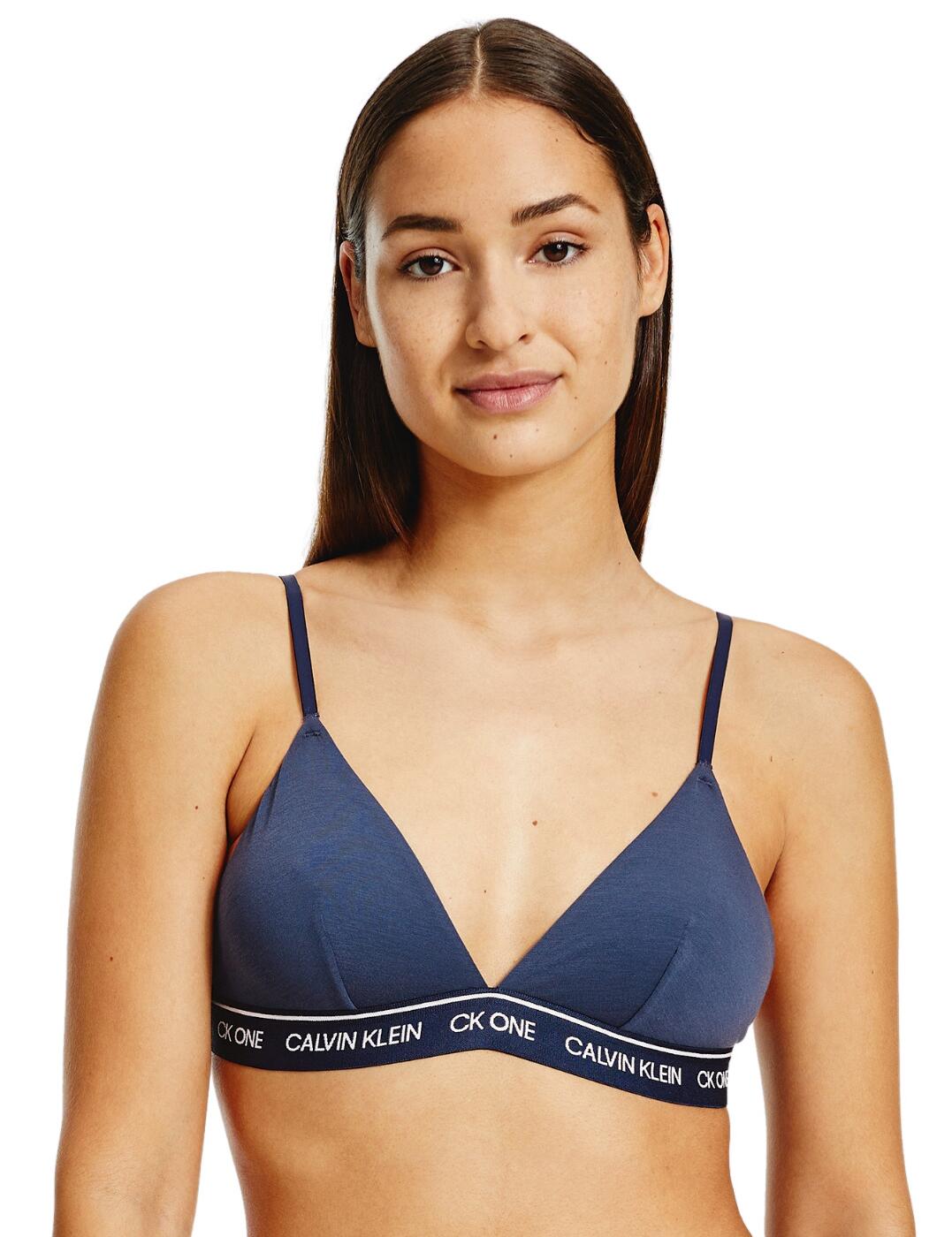 If you love fashion and the environment, the CK One Recycled collection is perfect for you. This comfy bra has sporty triangle cups and a plunging low neckline. The unlined cups and non-wired design creates the utmost comfortable fit perfect for all-day wear or lounging. For a sexy coordinated look, wear with matching lingerie from the CK One Recycled range by Calvin Klein.  Non-wired cups Popular, plunging centre for a fantastic cleavage Non-padded cups for a natural look Hook and eye fastening Branding on the under-bust band Adjustable shoulder straps Country of origin: Sri Lanka Composition: 89% Recycled Polyester &pipe; 11% Recycled Elastane Listed in UK sizes  51919-93568 000QF6501E Unlined Triangle Bra