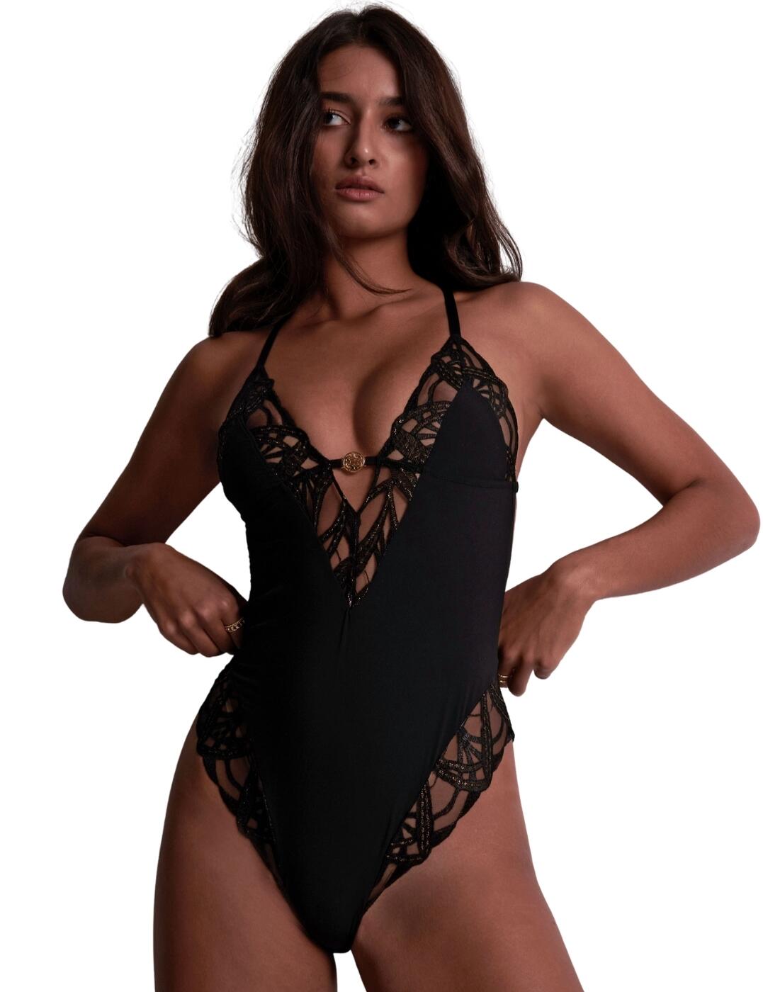 Welcoming the Aubade My Desire bodysuit, an exquisite addition to Aubade's lingerie line that blends sensuality and comfort. Crafted with premium materials, it features elegant embroidery, a soft matt fabric, and a wireless design for ultimate comfort. The non-padded, plunging neckline enhances natural curves, while gold-tone details add glamour. With double shoulder straps and a high leg rise, this bodysuit ensures a stylish fit. Perfect for modern, confident women, it offers moderate rear coverage and is ideal for any occasion.