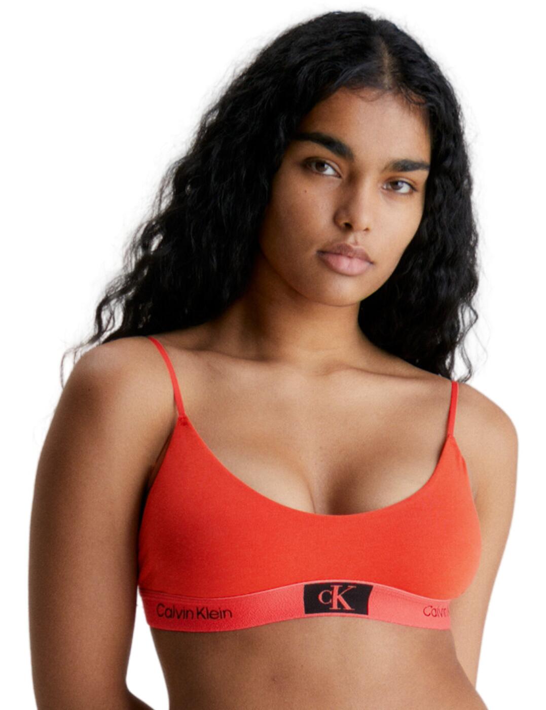 Every woman needs a go-to bralette that she can rely on day in and day out for everyday style and comfort and this Calvin Klein CK1996 unlined bralette is a must-have staple for any wardrobe. Get a designer feel without compromising on comfort with this bralette that has a scoop neckline, non-padded cups and a wireless design, letting your body move freely and naturally throughout the day. The thin adjustable straps combined with the soft opaque fabric make for a casual yet chic addition to any outfit. You'll never have to worry about sacrificing style for comfort with the branded elasticated underband that adds a designer look. For the busy woman on the go, the easy pull-on design is just what you need. And if you're looking to complete the look, then be sure to check out the coordinating lingerie by Calvin Klein.  Unlined bralette Scoop neckline Non-padded Wireless Thin adjustable straps Easy pull-on style Plain opaque soft fabric Branded elasticated underband Matching lingerie is also available Country of origin: Thailand Composition: 69% Cotton &pipe; 21% Recycled Cotton &pipe; 10% Elastane Listed in UK sizes  61539-107897-1430522 000QF7216E Bralette