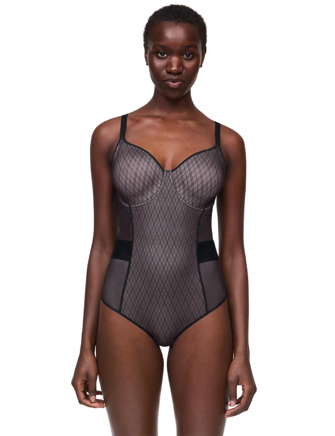 Slip into something luxurious and comfy with the Chantelle Smooth Lines bodysuit. Whether you’re dressing up for a special occasion or opting for a more relaxed look, this bodysuit will be your go-to lingerie piece. Crafted with a beautiful geometric line design and moulded cups, it offers security and a flattering, comfortable fit. Pieces of plain mesh on the sides ensure breathability, while the belt made of a nervous mesh band outlines and enhances the waist. An opening between the legs ensures that you can place and remove the garment with ease, and elastic finishes under the arm holes make them extra comfortable. The hook and eye closure and adjustable straps create a perfect balance between style and comfort. Plus, it offers full rear coverage for those who prefer a more supportive look.  Bodysuit Geometric line design Moulded cups Underwired Non-padded Pieces of plain mesh on the sides The belt is made of a nervous mesh band to outline and enhance the waist Opening between the legs by pressure Elastic finishes under the arms Hook and eye closure Adjustable shoulder straps Full rear coverage Country of origin: Vietnam Composition: Tulle: 79% Nylon &pipe; 21% Elastane Composition: Gusset: 100% Cotton Composition: Tulle lining side: 100% Nylon Listed in UK sizes  61556-106659-1409979 C11N70 Body