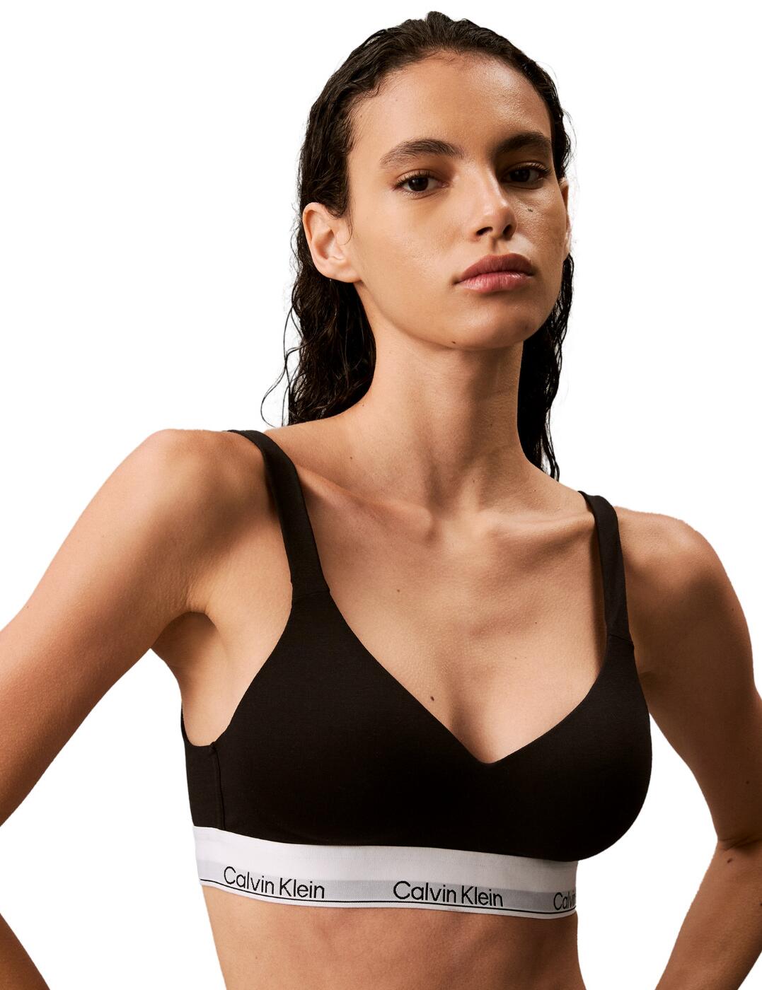 Experience the perfect combination of comfort and style with the Calvin Klein Modern Cotton lift bralette. With its full cup coverage, this bralette offers maximum support and a flattering shape. It features a trendy V-neckline that adds a subtle touch of sensuality to your everyday look. The soft moulded cups further enhance your natural shape, ensuring you feel confident and comfortable all day long. But don't be fooled by the lack of wires, this bralette is still packed with a powerful lift effect. The padded cups give your bust a gentle boost, giving you a lifted and beautifully shaped silhouette. Not only is this bralette practical and comfortable, but it also offers a touch of versatility with the adjustable and convertible shoulder straps. Complete your designer lingerie set today with the matching coordinates available from the Calvin Klein Modern Cotton collection.