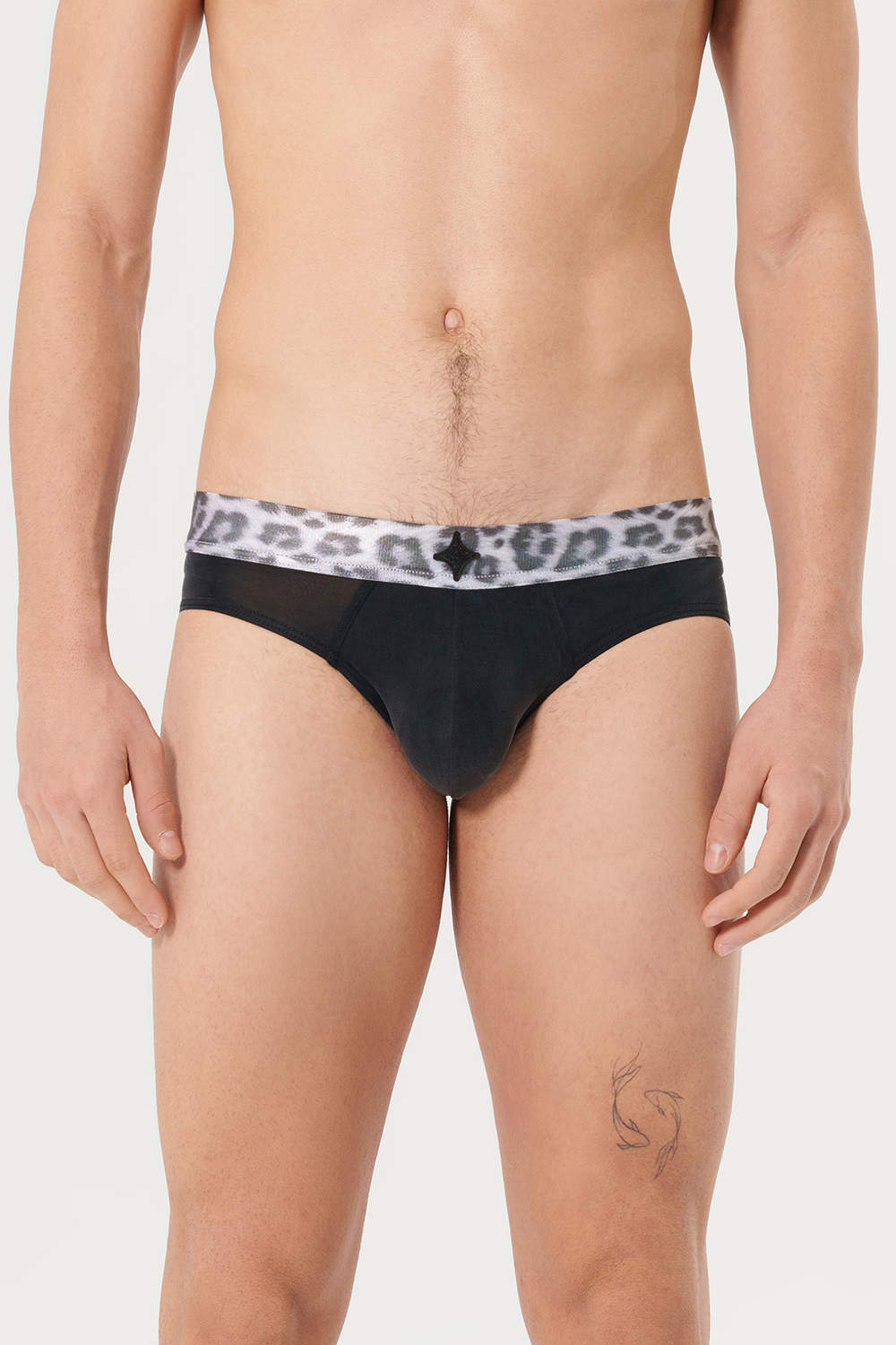 Prisma Erevos Cupro Leopard Black Briefs feel like silk. Men’s underwear bikinis in fluid fabric with a lined pouch. Shop luxury male slips – satiny spot elastic with blink logo