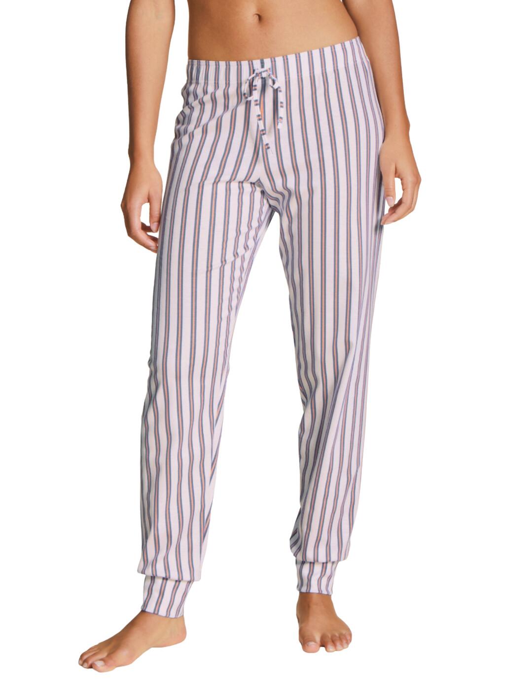 Calida of Switzerland is renowned for producing classic nightwear and the Favourite Flowers collection combines these designs with bold floral prints. These timeless pyjama pants have a full-length design and soft cuffed hem that is sure to keep you warm and snug. An elasticated waistband allows for a comfortable individual fit. Made the utmost premium cotton with a super soft feel for the perfect night's sleep.  Timeless pyjama style Full-length design Comfortable elasticated waistband Soft cuffed hem Decorative string on the waistband Machine washable Country of origin: Hungary Composition: 100% Cotton Listed in UK sizes.  53305-95596-1242928 29995  Pyjamas