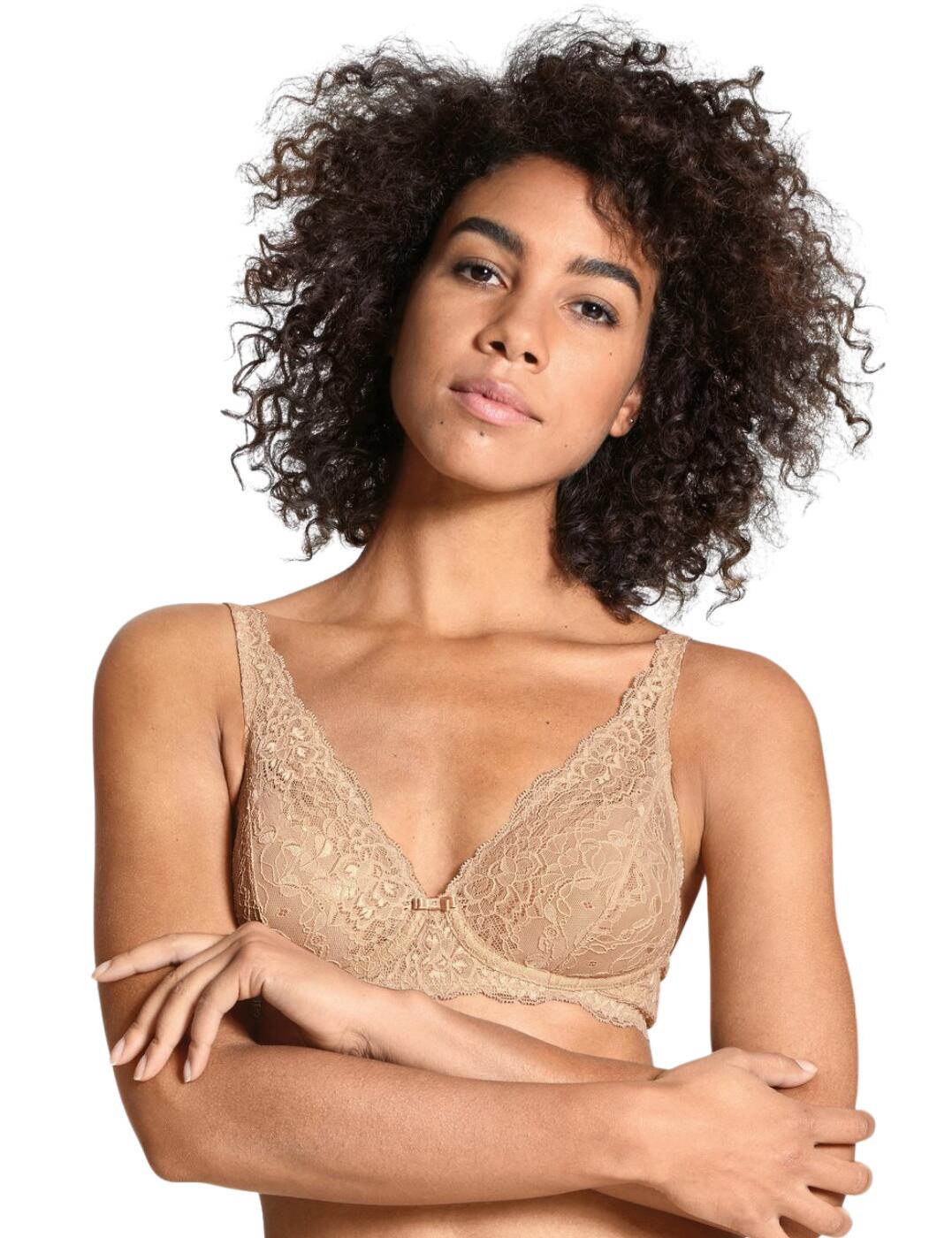The Sensual Secrets collection boasts luxurious everyday favourites with a subtle flirty style. This timeless bra offers the utmost comfortable fit with soft non-padded cups and a non-wired design. The luxurious lace with scalloped edges adds a flirty feminine finish. A vertical seam design and special power mesh fabric ensure support and uplift without the need for underwiring and heavy padding. Wear with coordinates from the Sensual Secrets series by Calida of Switzerland for a flirty relaxed look.  Flirty feminine lace Plunging neckline Non-padded cups Non-wired Supportive power mesh fabric Adjustable straps Hook and eye closure Machine washable Country of origin: Hungary Composition: 87% Polyamide &pipe; 13% Elastane Listed in UK sizes  53311-95605-1243029 3131  Non-Wired Bra