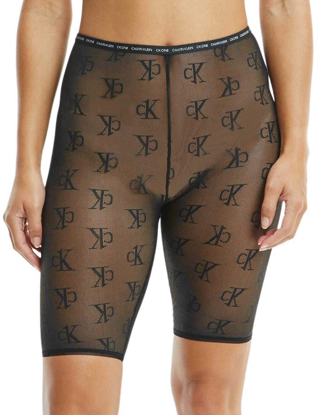 The CK One Logo Mesh biker short by Calvin Klein is crafted from sheer close-knit mesh giving it an alluring appearance. A high-rise waist boasts a comfortable elasticated waistband featuring the iconic CK branding. The sheer mesh is adorned with the CK signature logo repeated. A small CK branded tag is featured on the rear waistband. The overall modest style featuring a mid-thigh length is offset by the sexy sheer mesh.  Close-knit mesh CK embroidery adorns the sheer mesh CK branded waistband and tag High waisted Mid-thigh length Country of origin: Sri Lanka Composition: 73% Recycled Nylon &pipe; 15% Nylon &pipe; 12% Elastane Listed in UK sizes  54317-97045-1269596 000QS6783E (UB1) Biker Short