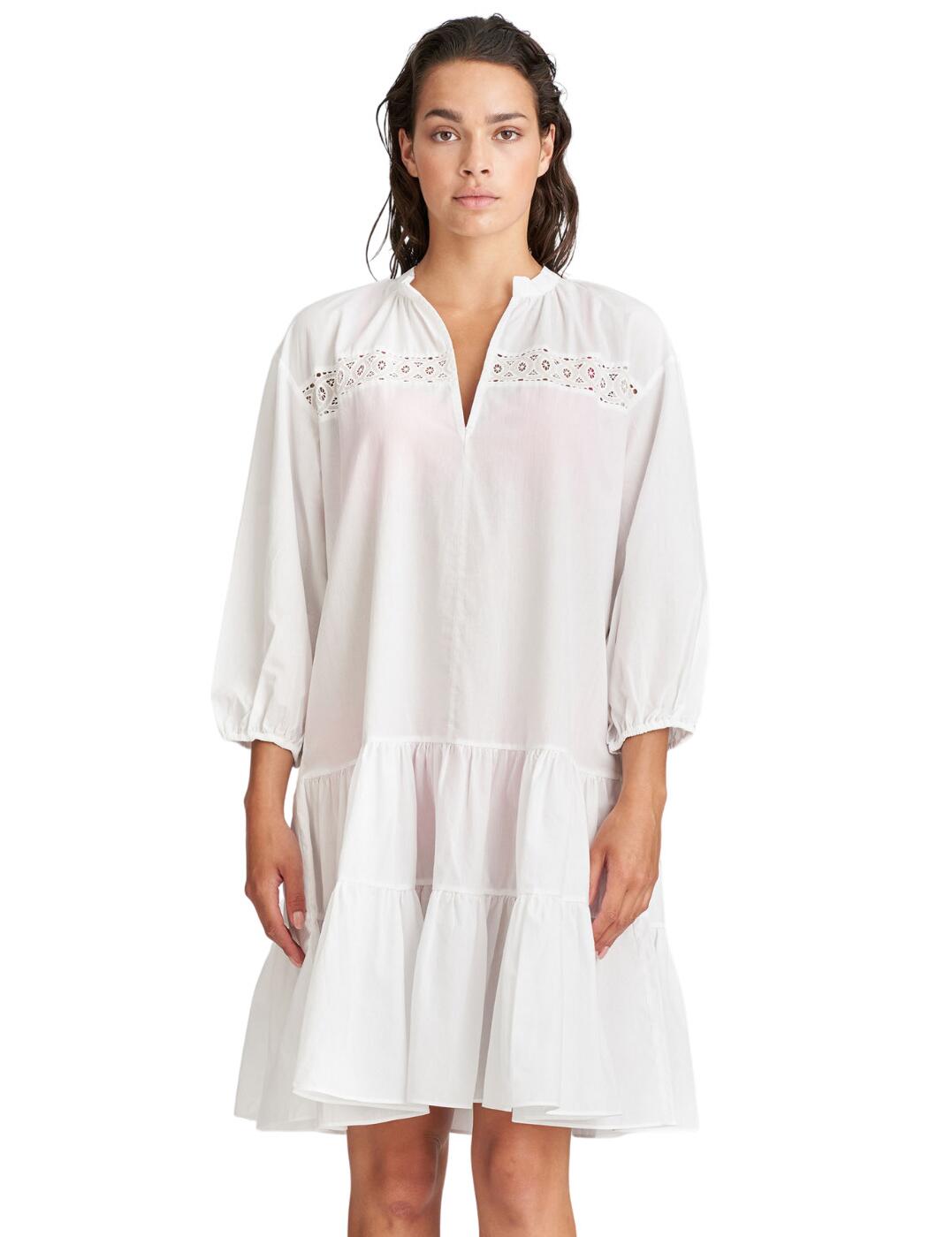 The Pamplona collection by Maire Jo is the embodiment of luxury this season! This stunning beach dress offers a gentle and airy feel with its soft cotton fabric and loose fit, making this perfect for a trip along the beach this summer. The gorgeous crochet chest detailing adds to the bohemium vibe along with the v-neckline that offers a peek of your beautiful decolletage. Knee-length fit and a 3/4 sleeve allow for moderate coverage but you can still show some off that sunkissed glow. Would look incredibly layered over your favourite bikini set and with a drink of your choice in hand.  Serving bohemium fantasy Light and breezy feel V-neckline for a cheeky peek Knee-length fit 3/4 length sleeves Crochet chest detailing Country of origin: Turkey Composition: 100% Cotton  Listed in UK sizes  54711-97580-1265838 1004480 Beach Dress