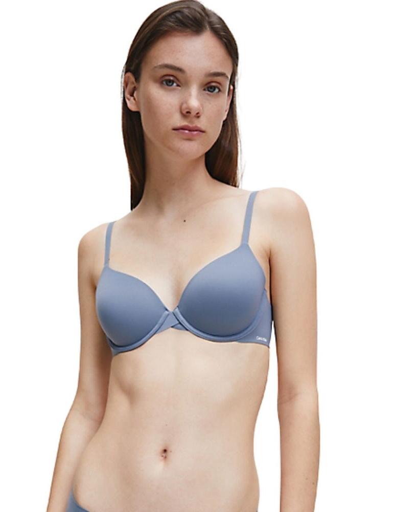 Feel Comfortable all day in the gorgeous lightly lined bra by Calvin Klein. This bra is light and easy to wear, preventing digging in and discomfort. The soft moulded underwire cups are for great support while giving a seamless finished look. Features adjustable straps and hook and eye closure at the rear. Calvin Klein logo detailing on the left-wing and strapping for a cute and fashionable look.  Light and flawless fit Prevents discomfort Soft moulded cups Underwired and seamless Adjustable straps Calvin Klein logo detailing on the strapping and left-wing Hook and eye closure at the rear Composition: 72% Polyamide &pipe; 28% Elastane Listed in UK sizes  46497-85279-1139501 0000F3837E Lightly Lined Bra