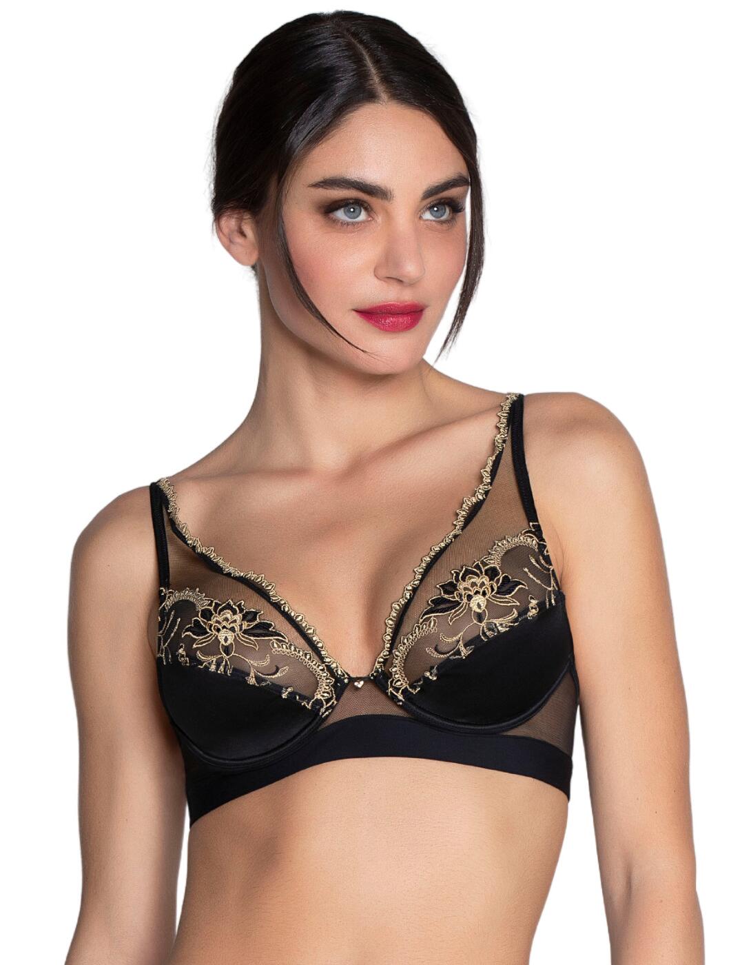 Indulge in iconic looks this season such as the Lise Charmel Eblouissante Icone glam push-up bra. This enchanting bra is designed to make you feel dazzling, with its seductive triangle shape and plunging neckline to accentuate your natural curves. Crafted with the finest multi-thread embroidery tulle, this bra is a work of art that will leave you feeling like a true masterpiece. The top cups are delicately adorned with intricate embroidery, creating a mesmerizing effect. And with the added support of underwire and light padding, you can feel both luxurious and comfortable at the same time. The bottom cup is made of soft silk satin, giving you the ultimate feeling of luxury against your skin. And for a touch of extra glamour, the sheer cleavage is adorned with sparkling rhinestones, making you feel like a true gem. The silk satin underband and adjustable shoulder straps ensure a perfect fit, while the hook and eye closure add both convenience and support. And don't forget, there are also matching coordinates available to complete your luxurious lingerie look.