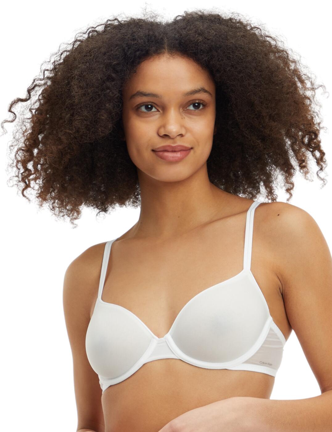 Calvin Klein's Sheer Marquisette range is fashion-forward without sacrificing comfort. This lightly lined demi bra is versatile and chic with the classic design and sheer material. The hook and eye fastening and adjustable straps ensure a perfect fit no matter what. The underwire provides support for your bust and the moulded cups give a nice shape under your clothes.  Underwired Hook and eye fastening Adjustable straps Sheer marquisette Sustainable materials Moulded cups Country of origin: Vietnam Composition: 72% Recycled Nylon &pipe; 28% Elastane Listed in UK sizes  57290-101223-1341284  000QF6068E Lightly Lined Demi Bra