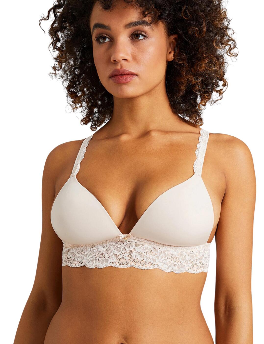 This beautiful soft bra from the Sweetessence series by Aubade is the perfect everyday bra with an elegant touch. Lace runs across the bottom acting as the underband to draw your body in, the stunning lace makes a journey all the way to the rear providing a very flattering finish with such a soft feel. A cute satin bow rests beautifully between the two incredibly soft cups with makes for a very feminine aesthetic, a little crystal also swings underneath which completely finalises this piece. The adjustable straps with laced edging provides such a unique look and feel against your shoulders which really brings a classy appearance to this perfect piece. It flatters your bust like no other with its plunging padded cups that showcase your gorgeous cleavage whilst the non-wired design helps keep your natural flirty shape.  Aubade's soft bra From the Sweetessence series Thick lace underband Classic hook and eye closure Plunge style neckline Comfortable, everyday wear Semi-sheer back panel Cute satin bow with a crystal drop Soft, padded cups Feminine, classy touch Adjustable, lace straps Match with some briefs from the Sweetessence range to create the perfect lingerie set Country of origin: Tunisia Composition: Lace: 76% Polyamide &pipe; 24% Elastane Composition: Knit: 78% Polyamide &pipe; 22% Elastane Composition: Cup material: 100% Polyester Listed in UK sizes  57594-101642-1317423 IKC10  Soft Bra