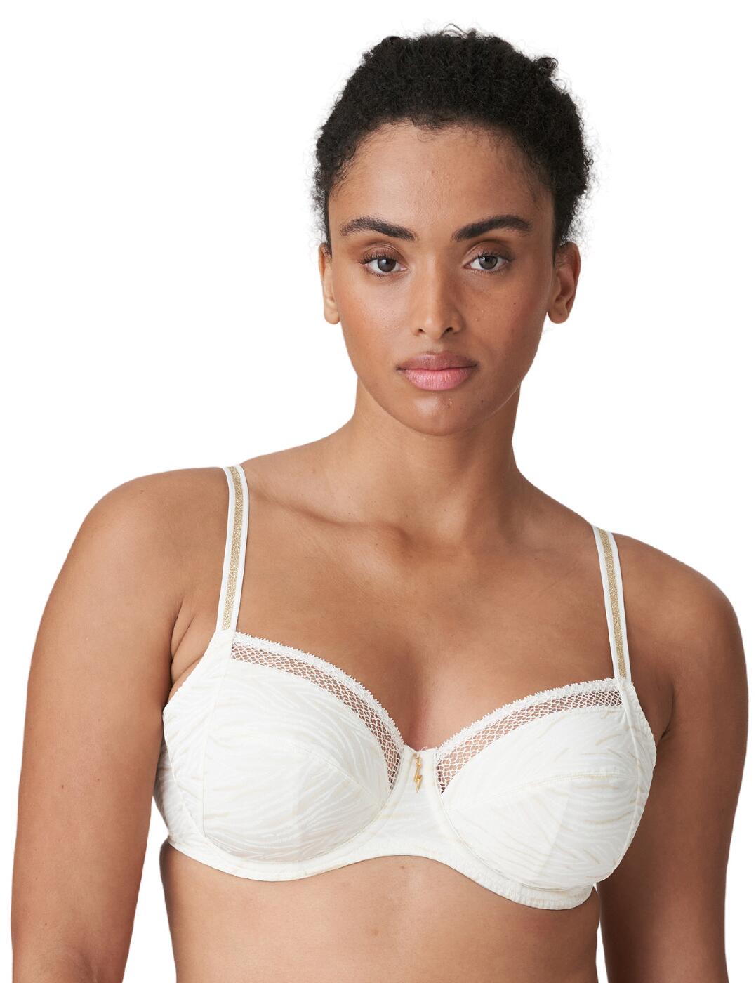 Prima Donna Twist's Newington collection brings you everyday elegance with this full cup bra. This piece is the perfect addition to your lingerie collection with underwiring for support and lift and non-padded cups for a natural and comfortable feel. This piece features a gorgeously delicate zebra-inspired print for an updated twist on a classic design. Straps are adjustable and boast beautiful glittery stripe detailing. Fastened at the rear with a traditional hook and eye for a secure fit with each wear. A pendant detailing adorns the centre bust of this piece to complete this chic look.  Full cup bra Non-padded Hook and eye closure Underwired Cute pendant detailing on centre bust Adjustable shoulder straps Smooth cups with an animal-inspired print for a chic look Glittery shoulder straps Small fit: Size up one cup size from your usual Prima Donna size Country of origin: China Composition: 73% Polyamide &pipe; 19% Elastane &pipe; Polyester Listed in UK sizes  58248-102581-1336791 0142200 Full Cup Bra