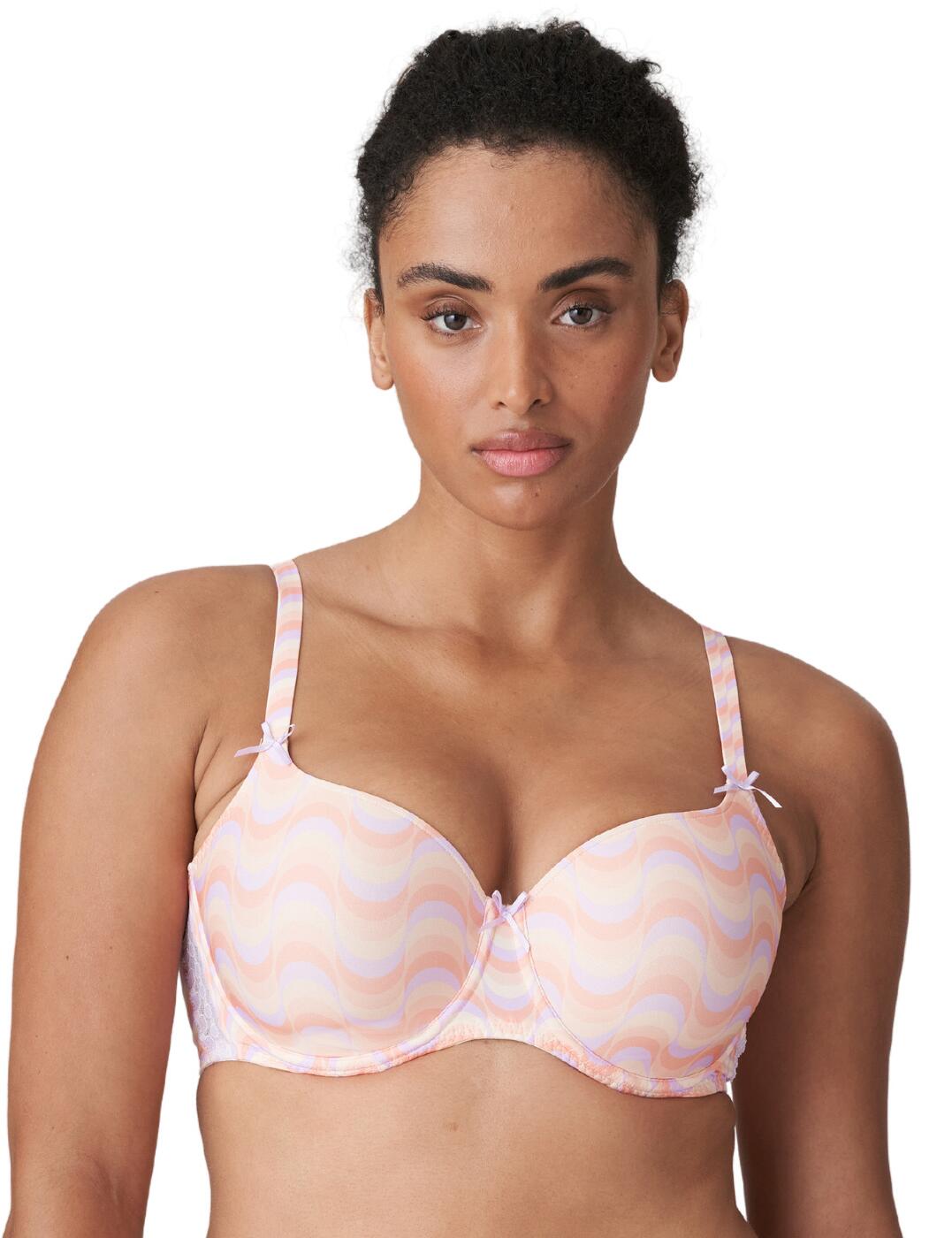 This stylish heart-shaped bra from the Goleta collection by the luxurious Prima Donna Twist brand will add a trendy retro style to any lingerie collection. Padding offers volume and creates a smooth rounded shape, whilst the heart-shaped design highlights the cleavage and offers moderate coverage. Underwiring offers added support, the adjustable shoulder straps ensure the perfect fit and the bow detail adds a subtle feminine feature. Complete the look with luxurious coordinating briefs from the Goleta collection by Prima Donna Twist.  Feminine lace and bow details Heart-shaped design Padded cups Smooth finish Underwired for support Hook and eye closure Adjustable shoulder straps Small fit: Size up one cup size from your usual Prima Donna size Country of origin: China Composition: 52% Polyester &pipe; 34% Polyamide &pipe; 14% Elastane Listed in UK sizes  58303-102648-1338226 0242250 Heartshape Padded Bra