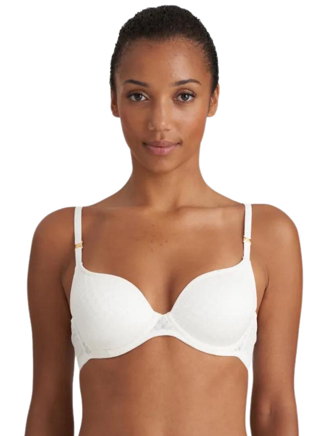 The Channing range by Marie Jo creates timeless pieces that are perfect for people who love the minimalistic vibe with luxurious touches. This heart-shaped padded bra is covered in an opaque graphic lace that runs along the straps which feature a gold X at the beginning of each strap. The cup flatters your bust like no other with padding in heart-shaped cups that create a plunging neckline which in combination enhances and highlights your incredible cleavage. It is underwired to help support whilst the mini hook and eye closure and adjustable straps help ensure you feel secure and comfortable all day long. Other items from the Channing range are also available for a matching elegant lingerie look.
