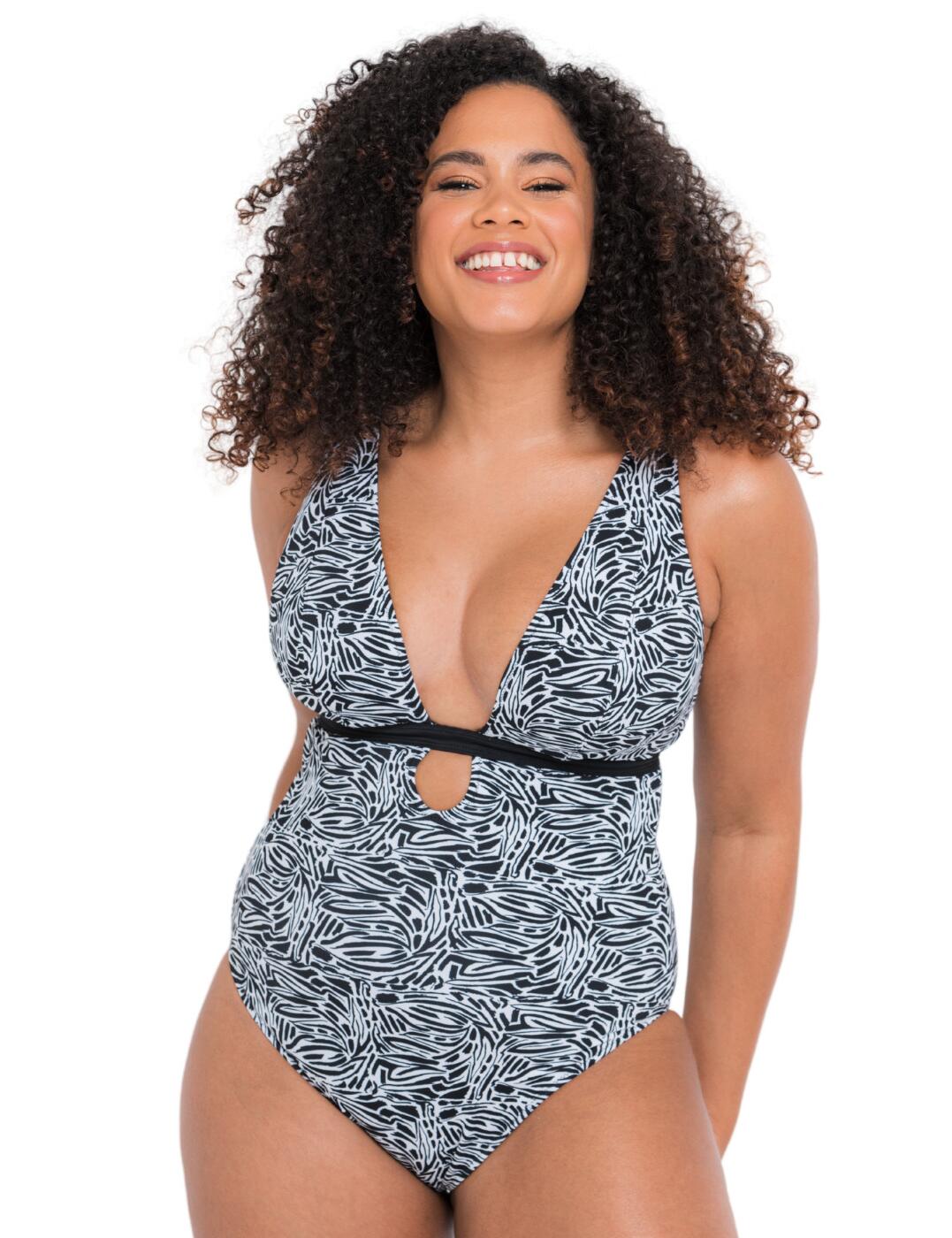 Introduce a new and exciting addition to your must-have swimwear drawer with this Sundown swimsuit from Curvy Kate. This piece gives you two gorgeous designs in one with its reversible design. The simplistic cut of a one-piece swimsuit is offset by the extremely deep plunging neckline, which accentuates your curves beautifully. Non-wired cups give you a comfortable fit, while triple-layered material subtly shapes your decolletage. This piece features adjustable shoulder straps, which can be worn in 3 different styles.  Extremely deep plunging neckline with triangle cups Reversible design Adjustable multiway shoulder straps G-hook back closure Moderate rear coverage Triple-layered cups Non-wired Country of origin: China Composition Main: 80% Recycled Nylon &pipe; 20% Xtra Life Lycra Composition Mesh: 65% Nylon &pipe; 35% Elastane Listed in UK sizes  58517-102923-1344096 CS025607 Swimsuit