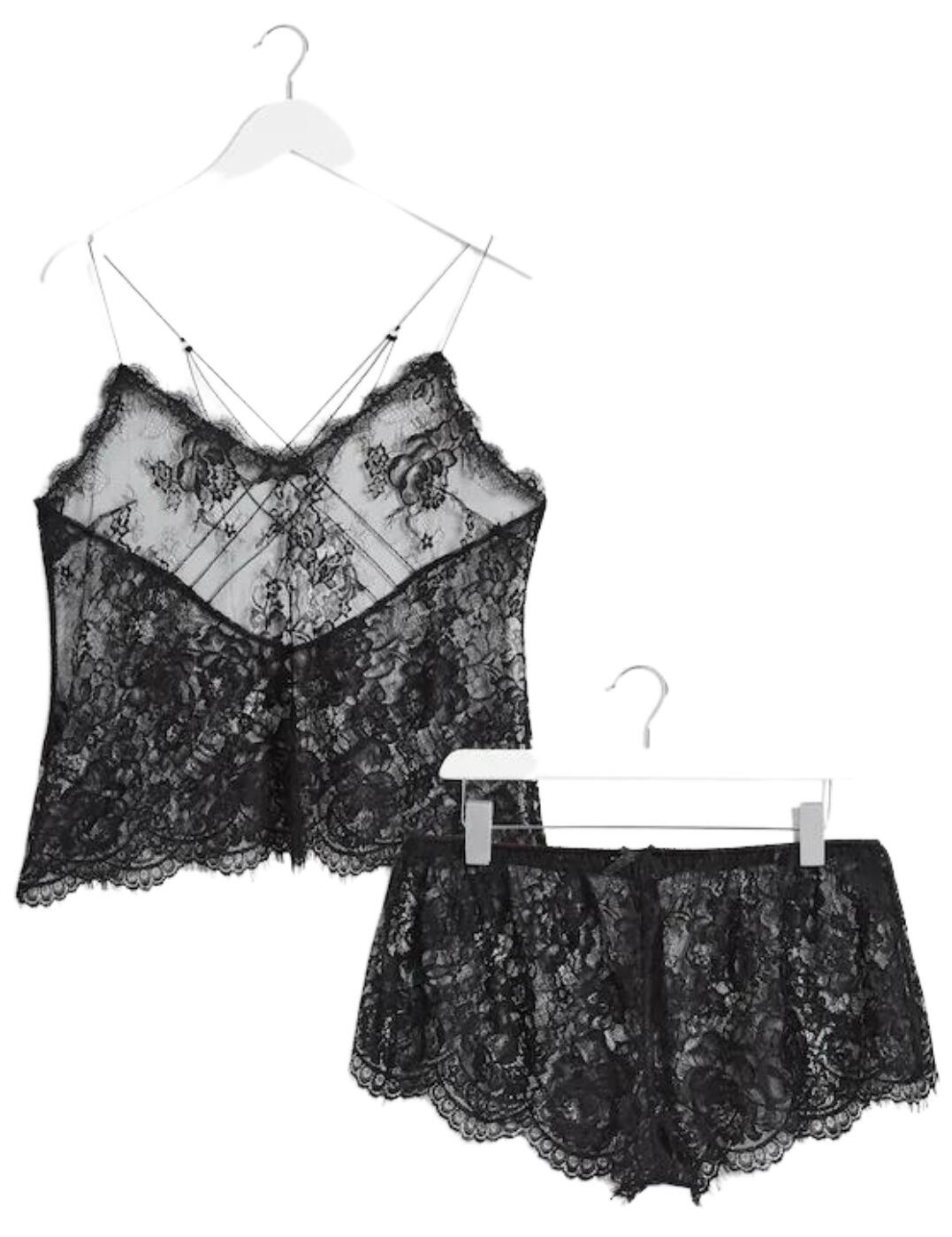 This elegant camisole and shorts pyjama set from Figleaves' Gigi Galloon range is sensual and chic, made from sheer floral lace for a seductive look. The top is non-wired and non-padded for a natural, lightweight feel, with delicate cross-over straps at the back keeping it in place. The shorts are crafted with sheer material for a tantalising look, while the elasticated waistband keeps them snug and secure. Beautifully scalloped edges provide a charming finishing touch to this set that is bound to entice and intrigue.