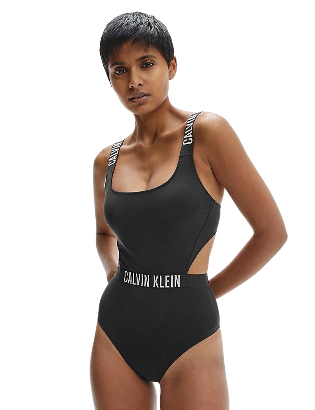 Calvin Klein presents the Intense Power collection, perfect for those wanting simplistic yet chic designs with an athleisure flare. This one-piece swimsuit is a powerful and stylish addition to anyone's wardrobe. Features the signature Calvin Klein logo on the straps and waist to accentuate your silhouette. Boasts cutout sides and back detailing for a sexy and flattering look, a total dream. With a scoop neckline and medium rear coverage this one-piece swimsuit allows you to show some skin whilst leaving a little to the imagination. Classy and full of character this piece is a must-have this season.  Sporty yet sexy Scoop neckline Soft moulded cups with removable padding Medium rear coverage Simple pull-on design Flattering side and back cutout Classic Calvin Klein elastic trims Created with 78% sustainably sourced fabrics Country of origin: China Composition: 78% Recycled Polyamide &pipe; 22% Elastane RRP: £80.00 Listed in UK sizes  54983-98053 KW0KW01653 Swimsuit