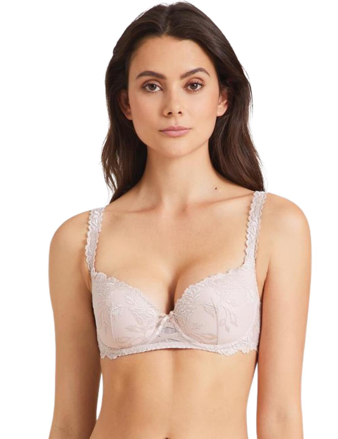 The Softessence collection by Aubade is effortlessly feminine. The sheer mesh creates a sultry look which is finished with delicate embroidery. Soft scalloped edges contour to the body and offer a complementary fit. The moulded cups offer great coverage and a smoother silhouette. The bridge of the bra is adorned with a luxe satin ribbon in a lattice design, finished with a bow at the top. Underwiring offers support and a natural lift. Adjustable shoulder straps and a hook and eye closure allow you to find your most comfortable fit.  Moulded cups offer a smoother silhouette and great nipple coverage A seductive blend of sheer and embroidered fabric Lattice satin ribbon on the bridge of the bra Country of origin: Tunisia Composition:Cup embroidery: 45% Polyester &pipe; 39% Polyamide &pipe; 16% Elastane Composition: Back embroidery: 47% Polyester &pipe; 38% Polyamide &pipe; 15% Elastane Composition: Middle embroidery: 46% Polyamide &pipe; 35% Polyester &pipe; 19% Elastane Composition: Cup lining: 100% Polyester Composition: Back lining: 100% Polyamide Listed in UK sizes  55010-98082-1271583 TMN04 Moulded Half Cup Bra