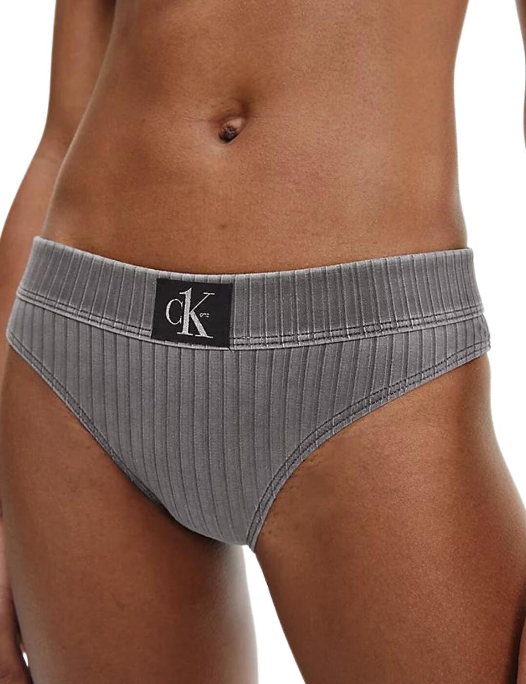 Feel your modern chic fantasy in the elevated CK Authentic collection from Calvin Klein. This bikini brief is a Calvin Klein staple with its embodiment of minimalism with a touch of edge. This piece is crafted from a luxuriously soft ribbed knit and has a vintage washed denim look for a unique twist. Features a low-rise waist and full rear coverage to make sure you're maintaining some modesty and comfort whilst also showing a flirty bit of skin. The elasticated waistband flaunts the signature Calvin Klein logo badge for an instantly recognisable look. Would look amazing with the matching bikini tops from the CK Authentic range this season!  Soft ribbed knit Elasticated waistband Fully lined Low-rise waist Full rear coverage Made from 91% sustainable fabric Country of origin: Sri Lanka Composition: 91% Recycled Polyamide &pipe; 9% Elastane Listed in UK sizes  55023-98098-1279770 KW0KW01719  Bikini Briefs