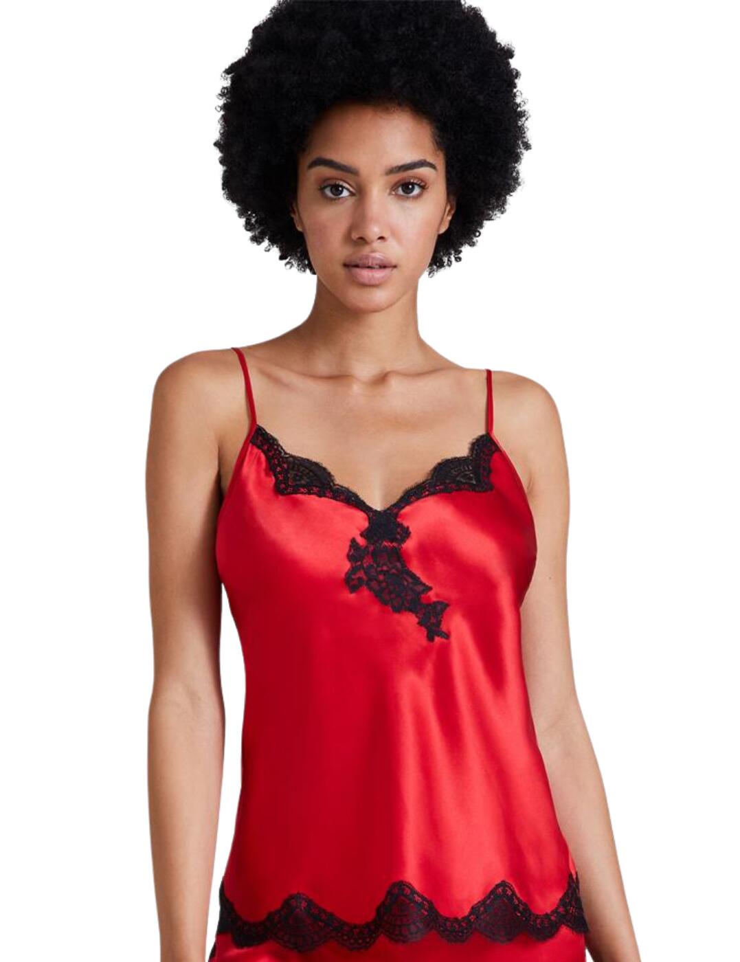 Lounge in luxury with the Toi Mon Amour collection by Aubade. This top features a flirty plunging neckline that highlights your curves and decolletage. The playful scalloped lace trims add femininity to this piece. Adjustable shoulder straps allow you to find your most comfortable fit. Thanks to the silk fabric this top will keep you cool and comfortable night after night.  Plunging neckline Lace details Adjustable shoulder straps Country of origin: China Composition: Main: 100% Silk Composition: Lace: 100% Polyamide Listed in UK sizes  55032-98115-1274028 QS38 Camisole Top