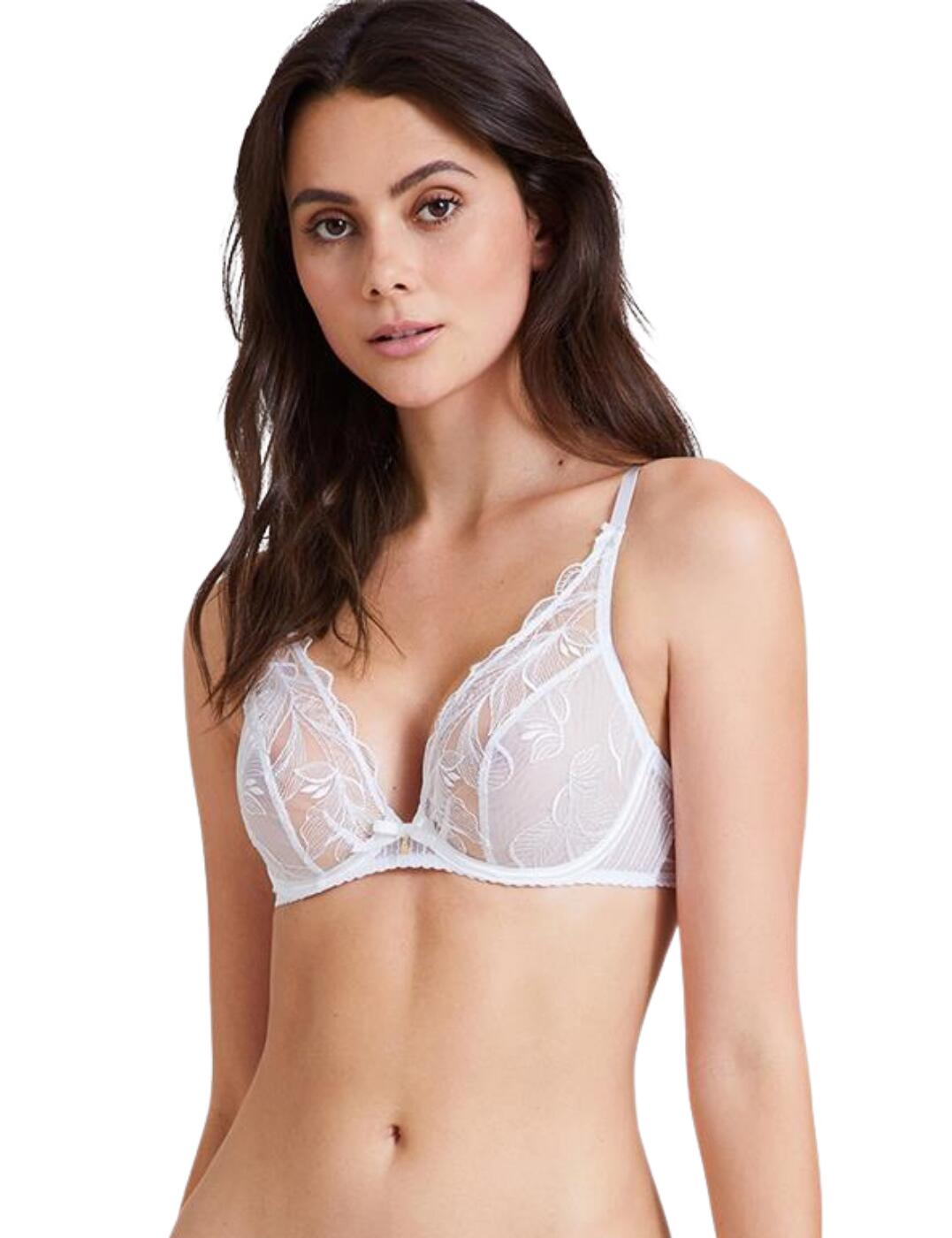 The flirty Fleur De Tattoo plunging triangle bra by Aubade is sure to turn up the heat this season. With sensual sheer mesh cups adorned in delicate embroidery, giving a teasing glimpse of your curves, this bra creates a truly alluring appearance. Scalloped edges contour to your breasts for a complimentary fit. The plunging cups highlight your curves and make it easy to conceal this bra under clothing. Underwiring will keep you feeling supported all day and offer a natural lift. Adjustable shoulder straps allow you to find the most comfortable fit. Finished with a charming satin bow holding a small jewel on the bridge of the bra.  Plunging cups Underwired for lift and support Sheer mesh cups adorned with embroidery Adjustable shoulder straps Hook and eye closure Country of origin: Madagascar Composition: Embroidery: 61% Polyester 32% Polyamide 7% Elastane Composition: Embroidery top cup: 68% Polyester 32% Polyamide Composition: Lining: 100% Polyester Composition: Tulle: 73% Polyamide &pipe; 27% Elastane Listed in UK sizes  55167-98292-1273235 TB12-6 Plunge Triangle Bra