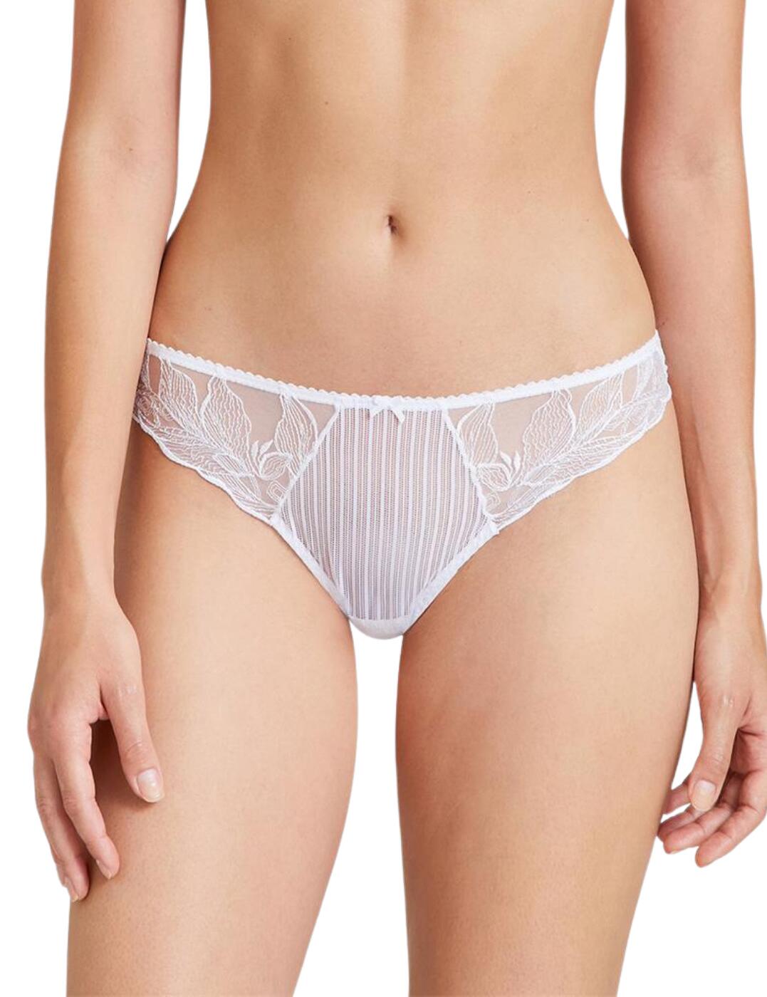 The Fleur De Tattoo Tanga is a timeless piece that will become a firm favourite in your collection. A flirty sheer tulle front is adorned with delicate embroidery finished with soft scalloped edges that contour to your body for a complimentary fit. The minimal rear coverage highlights your curves. Sheer fabric adds to the alluring look of this Tanga. Decorated with floral embroidery and finished with a keyhole cut-out which is decorated with a luxe satin bow. Pair with the matching lingerie from the collection to create a coordinated look.  Flirty sheer embroidered tulle Seductive tanga shape reveals your curves Matching lingerie available Country of origin: Madagascar Composition: Front embroidery: 62% Polyester &pipe; 31% Polyamide &pipe; 7% Elastane Composition: Embroidery back: 61% Polyester &pipe; 32% Polyamide &pipe; 7% Elastane Composition: Seat: 100% Cotton Composition: Front tulle: 73% Polyamide &pipe; 27% Elastane Listed in UK sizes  55178-98303-1273577 TB26-6 Tanga Brief