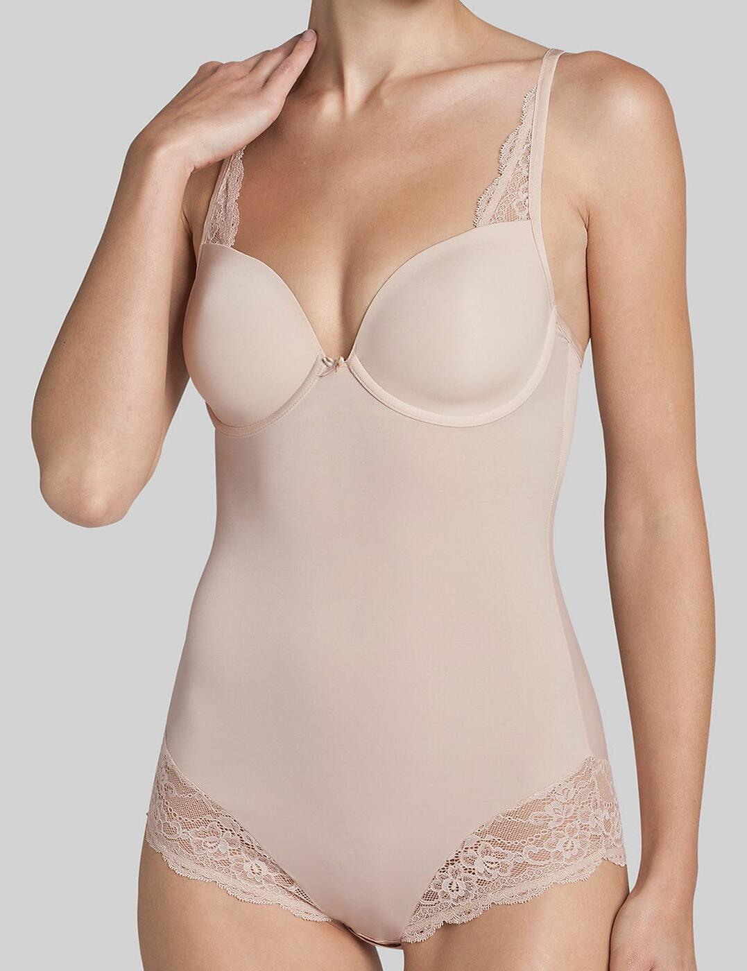 Simply stunning! Taking a modern twist upon the classic body, with the fabulous new addition to the Contouring Sensation range by Triumph, comfort and style is assured! Offering a chic and sexy, glamorous shape to the entire body, gently sculpting and contouring the shape of your dreams, this beautiful body is gently complimented by intricate lacework and decorative accents!  Chic and simplistic, yet elegant design Gently moulded cups for a stunning cleavage! Offers tantalising glimpses of skin for a truly tempting look! Offers good overall body control and an excellent shape/toned look! Gently complimented with intricate lacework and decorative accents Easy to open hook and eye crotch fastener for additional comfort and security Matching coordinates available Adjustable straps Composition:- 64% Polyamide &pipe; 21% Elastane &pipe; 1% Viscose &pipe; 14% Polyester Listed in UK sizes   30255-56311-701844 10143652 Body