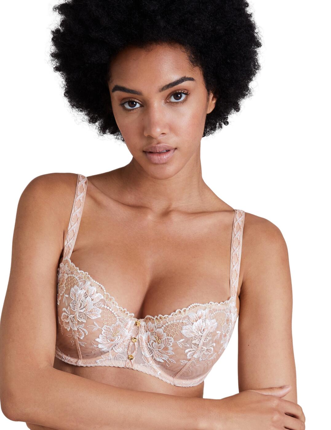 Feel gorgeous in this fresh spring design of the Melodie D'ete collection from the luxurious Aubade. This bra brings out the feminine charm of blooming flowers with the beautiful floral embroidery on the semi-sheer cups, further accentuated by the shiny lurex thread woven into the pattern. The underwired cups in a half-coverage design mesh perfectly with the classic balcony style, providing you with alluring decolletage while not compromising on comfort. The piece is finished off with an interesting braided pattern on the front of the adjustable shoulder straps, with metallic hardware in between the breasts giving a cute final touch.  Classic balcony style Stunning floral embroidery on the cups Semi-sheer materials 2-part half-cup coverage Adjustable shoulder straps Hook and eye back closure Non-padded Underwired Matching coordinates available Country of origin: Tunisia Composition: Cup embroidery - 100% Polyester Composition: Lace front/back - 84% Polyamide &pipe; 16% Elastane Composition: Lining - 100% Polyester Listed in UK sizes  55225-98392-1275877 ICF14 Half Cup Bra